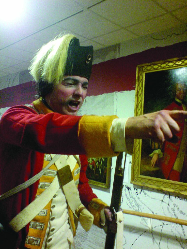 A life-size figure uniformed as a light infantry soldier of the American Revolution period.