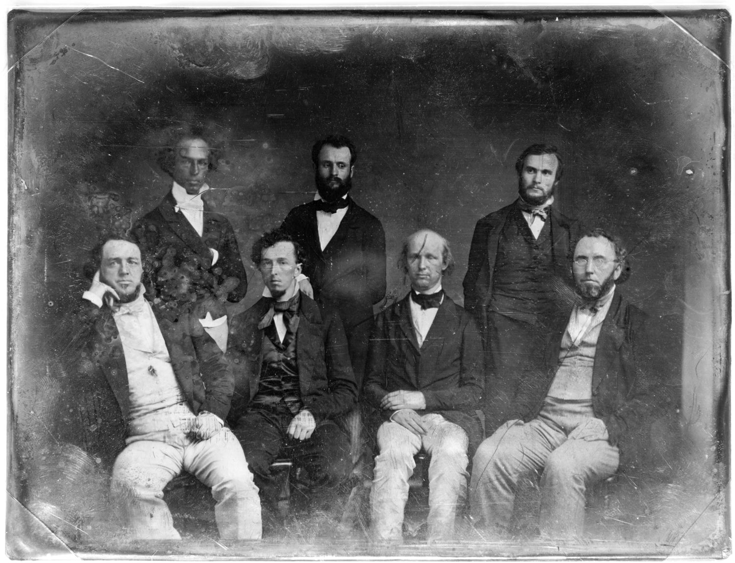Editorial staff of the New York Tribune, including Horace Greeley (seated third from right) and Charles A. Dana  (standing at center).