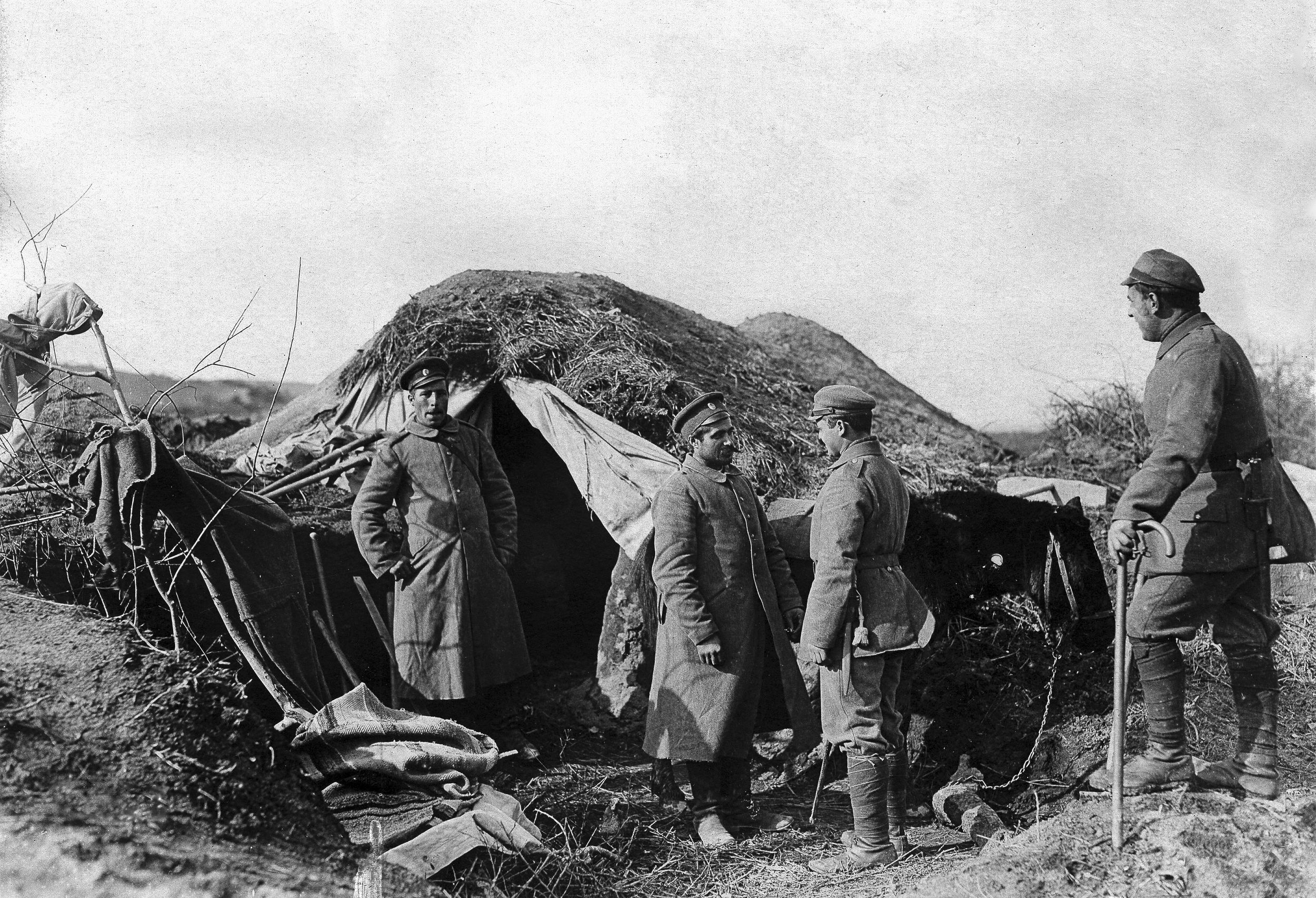 Bulgarian soldiers gather outside their primitive but effective “bunker” on the Salonika front in Macedonia, January 10, 1917. 