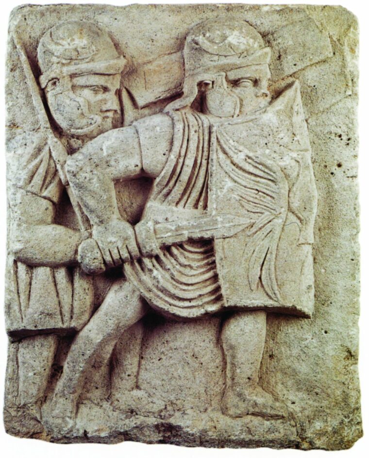Another relief shows Roman legionaries in fighting positions. 