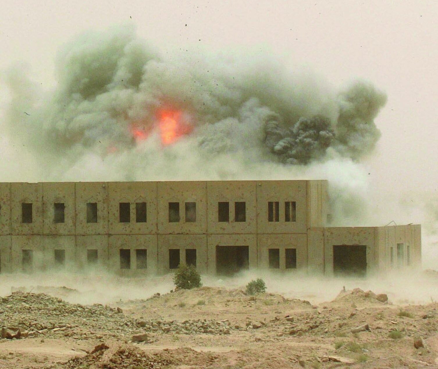 A fireball emerges from the smoky debris of a missile strike in Iraq on September 23, 2005.