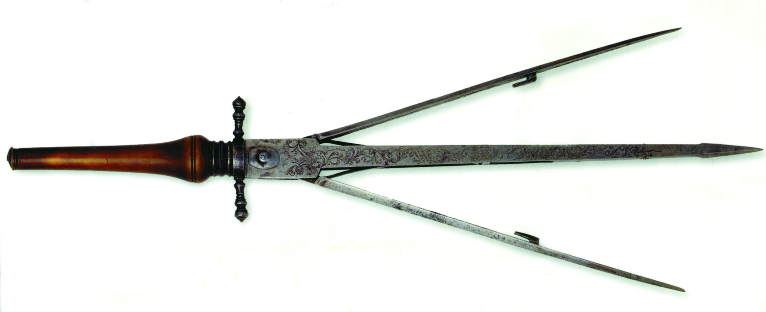 The 16th-century sinistra was was designed to catch an opponent’s sword blade and wrench it away. It was released with a slide button then expanded into a V-shape. 