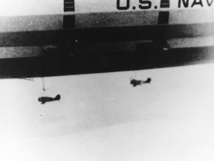 Two F9C-2 Sparrowhawks are attached to the Macon’s underbelly during this 1934 flight.