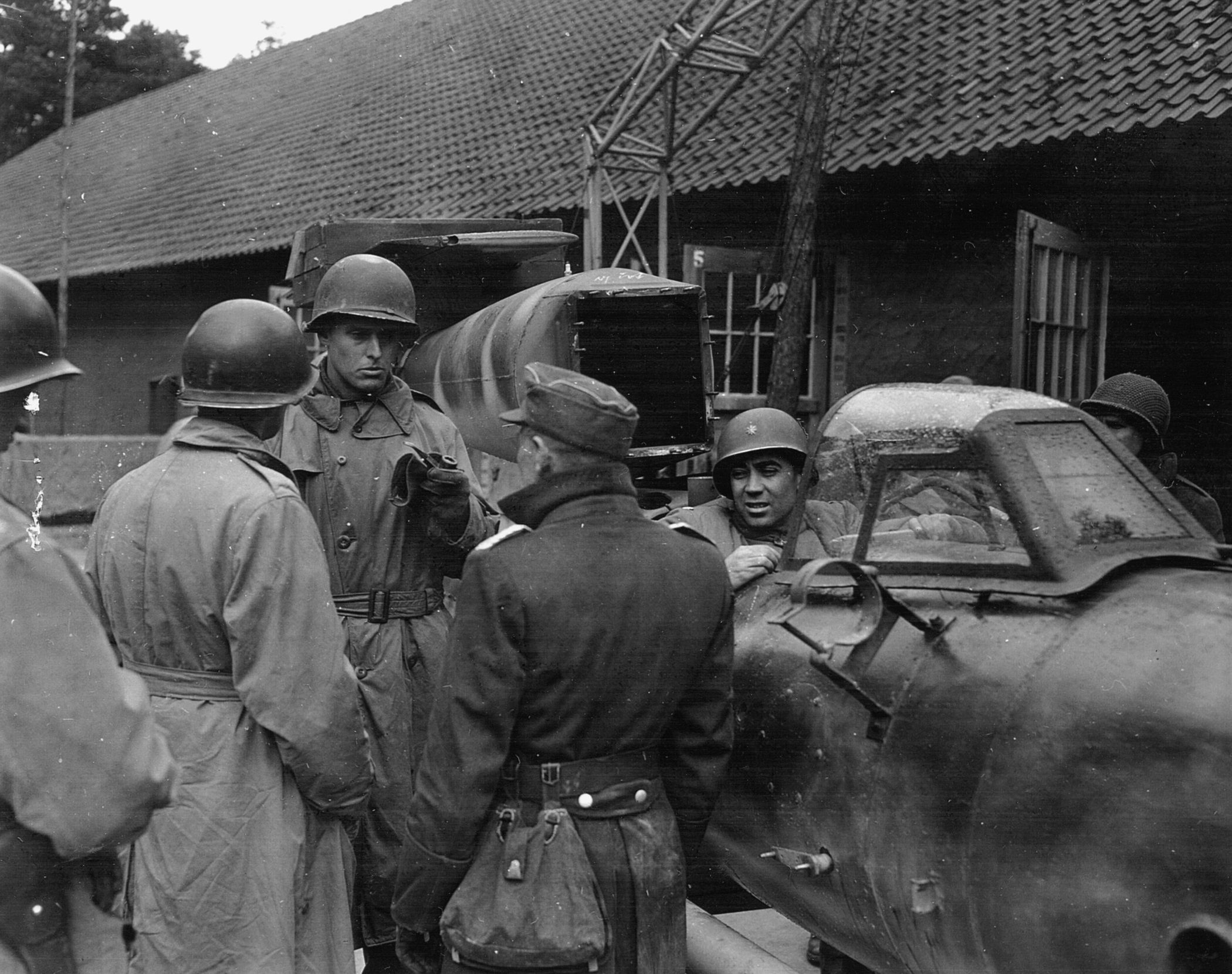 Soldiers of the 5th Armored Division examine a German V-1 suicide bomb.