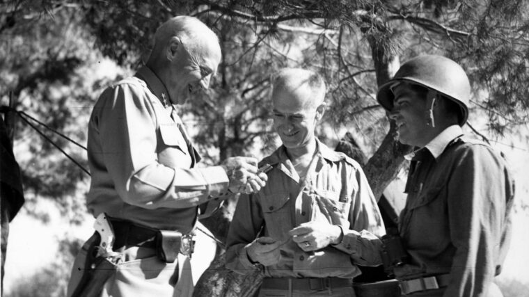 General Patton signs an autograph for war correspondent Ernie Pyle.