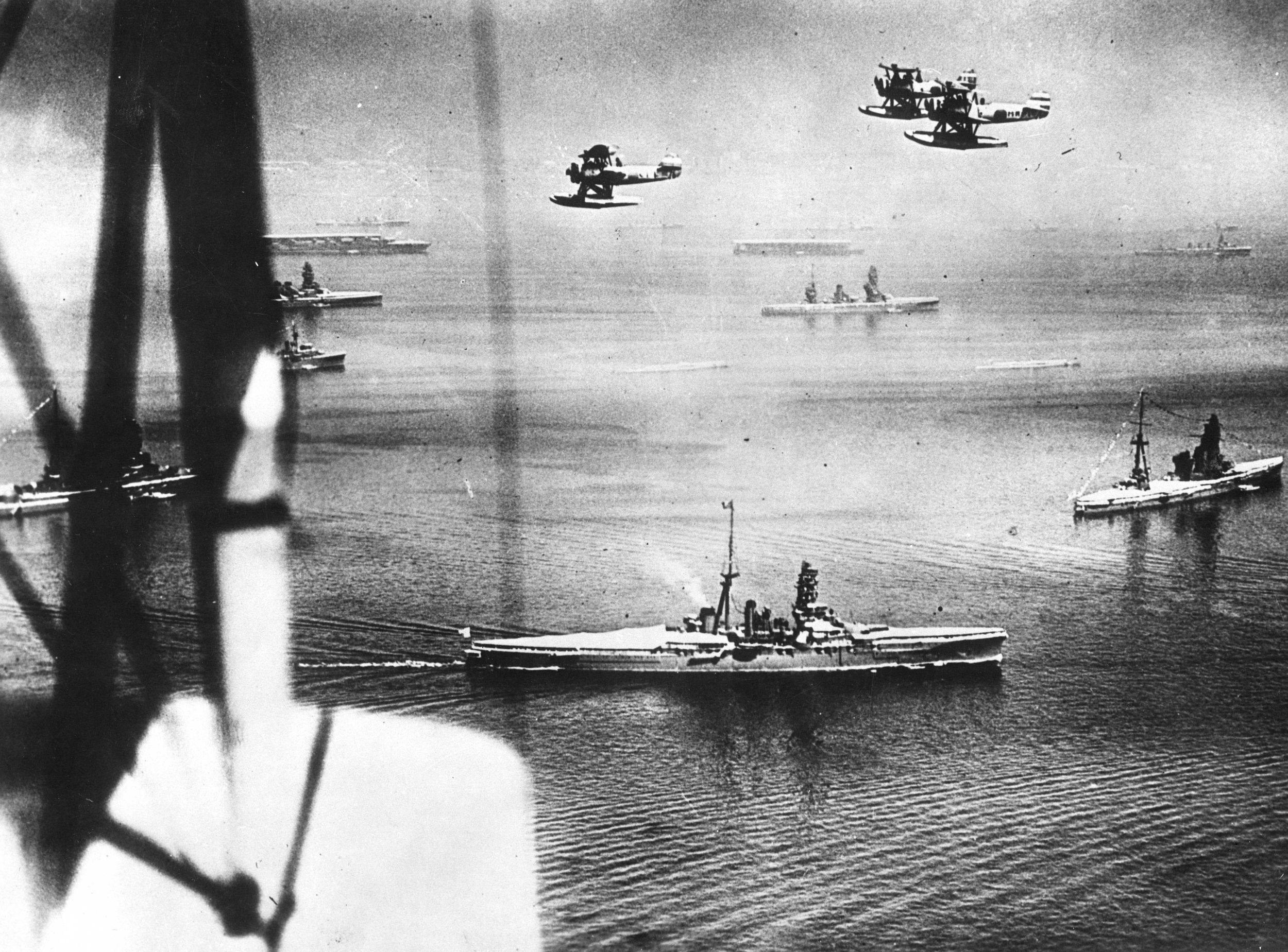 A formation of float planes flies above warships of the Imperial Japanese Navy during peacetime maneuvers. American submarines were successful in their attacks on warships as well as merchant vessels. 