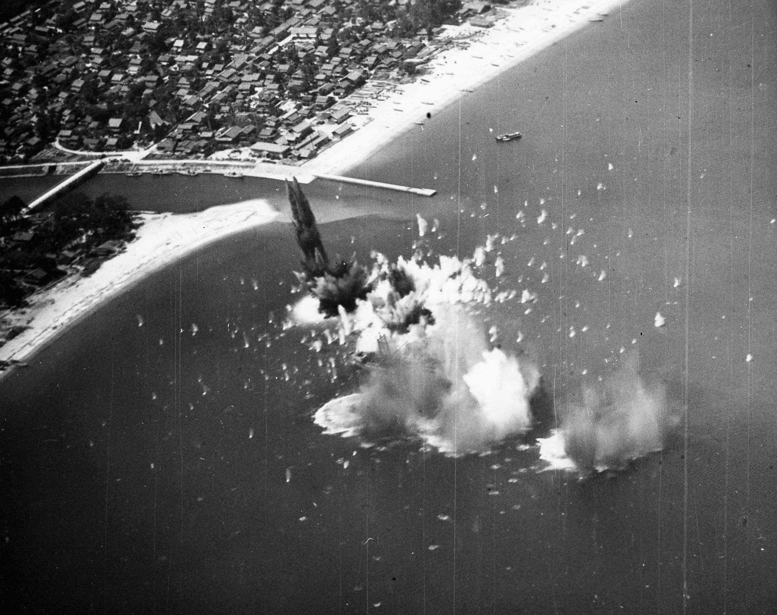 Moments after the left photo was taken, the same Japanese ship explodes following repeated hits by bombs from American carrier-based aircraft.