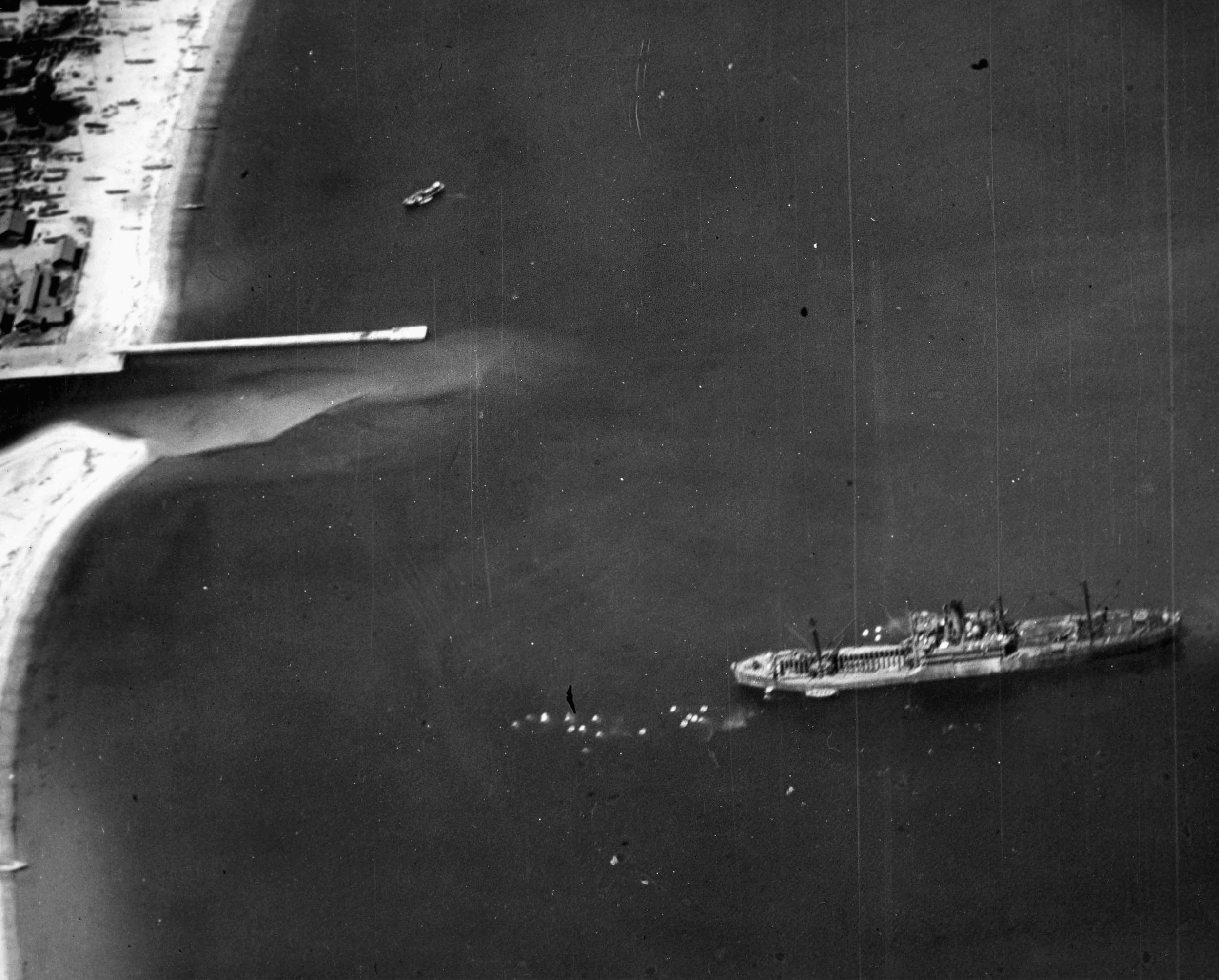 A 5,500-ton Japanese freighter is pictured just prior to being attacked by aircraft of the U.S. Third Fleet near Tsurga on July 30, 1945. 