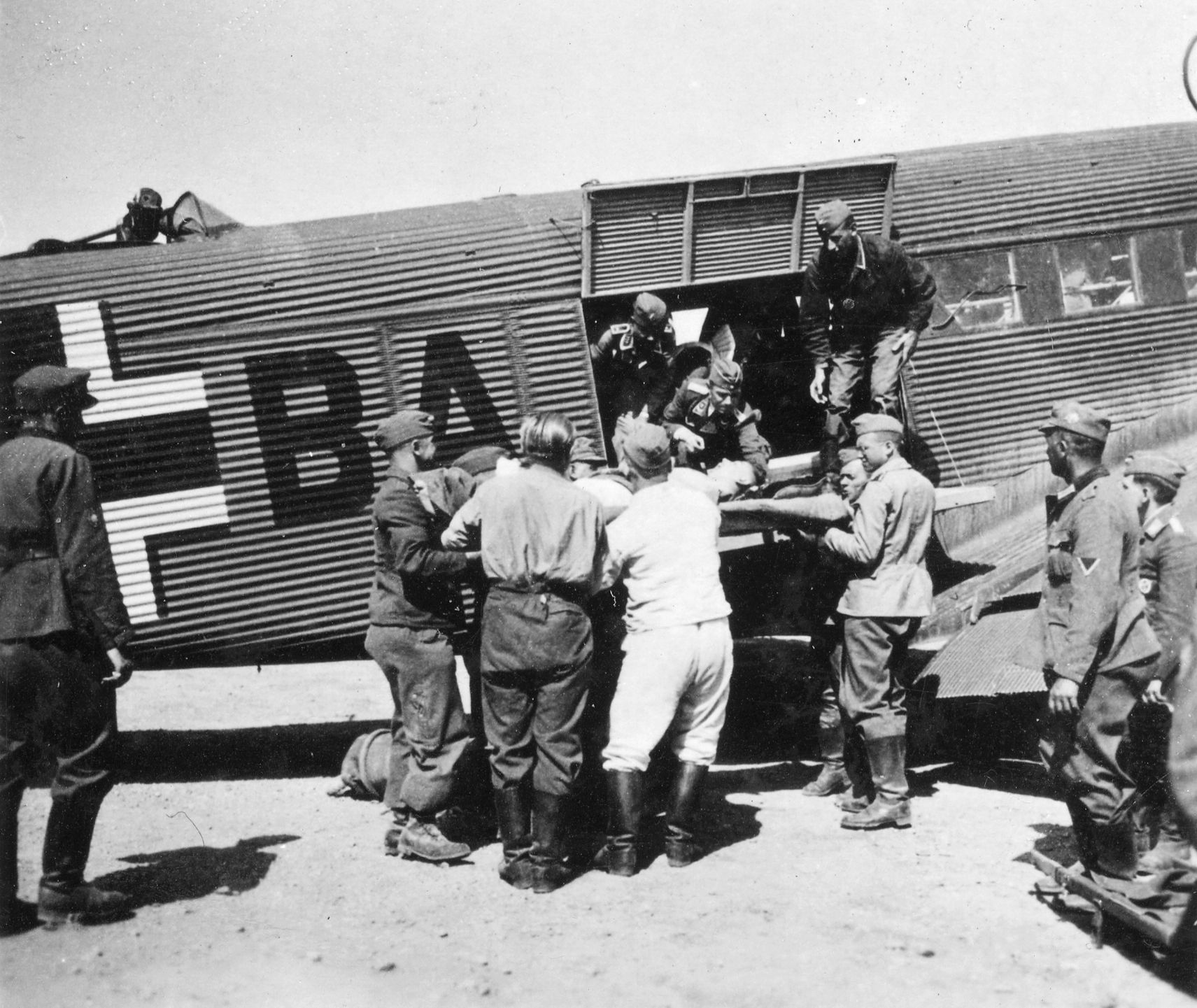 A Junkers Ju-52 returns from Crete, bringing home wounded parachutists and Alpine patrol soldiers.