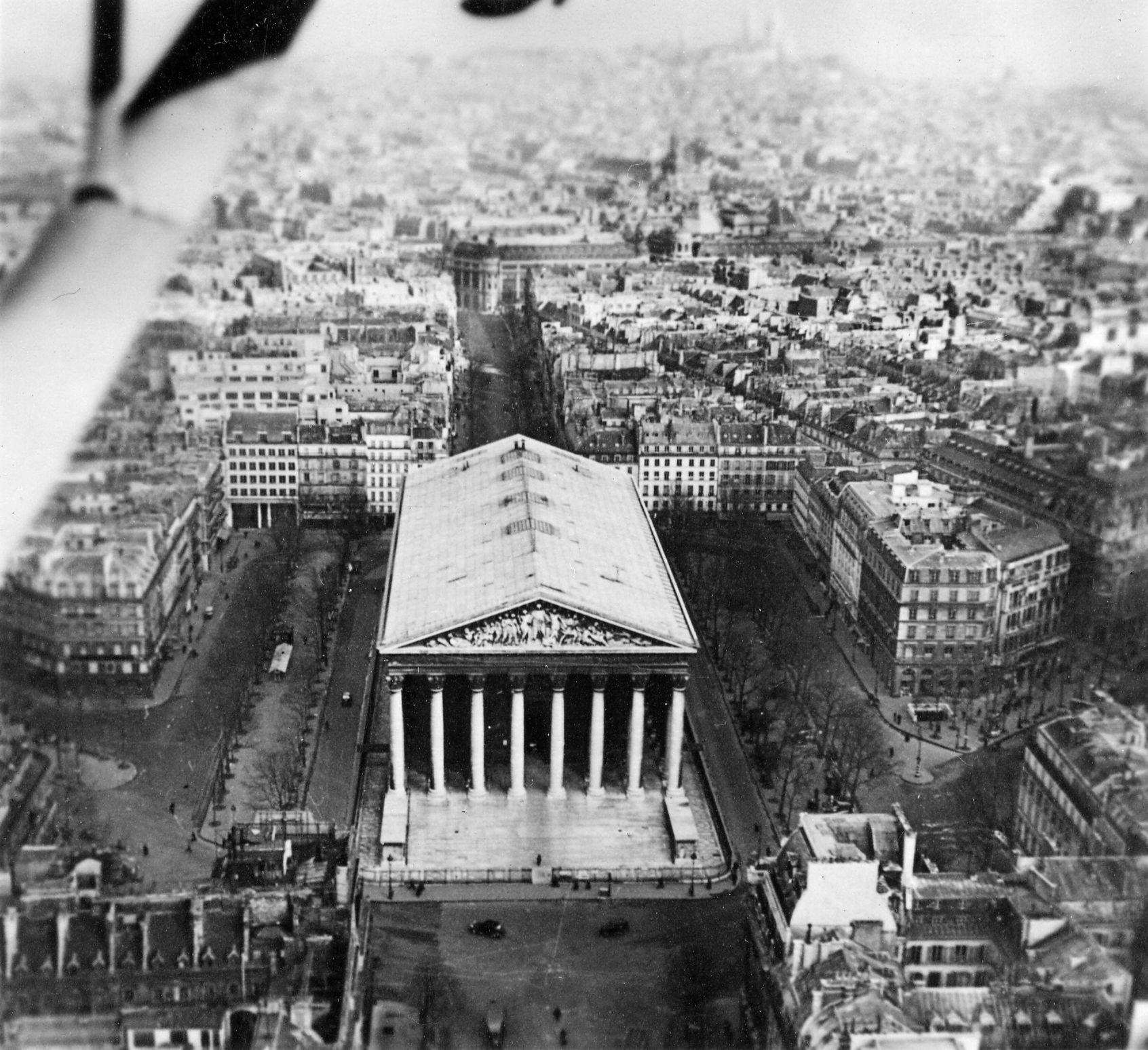A German reconnaissance plane shot this photo over Paris. In the foreground is the Madeline Church; in the background are Montmartre and Sacre Coeur.