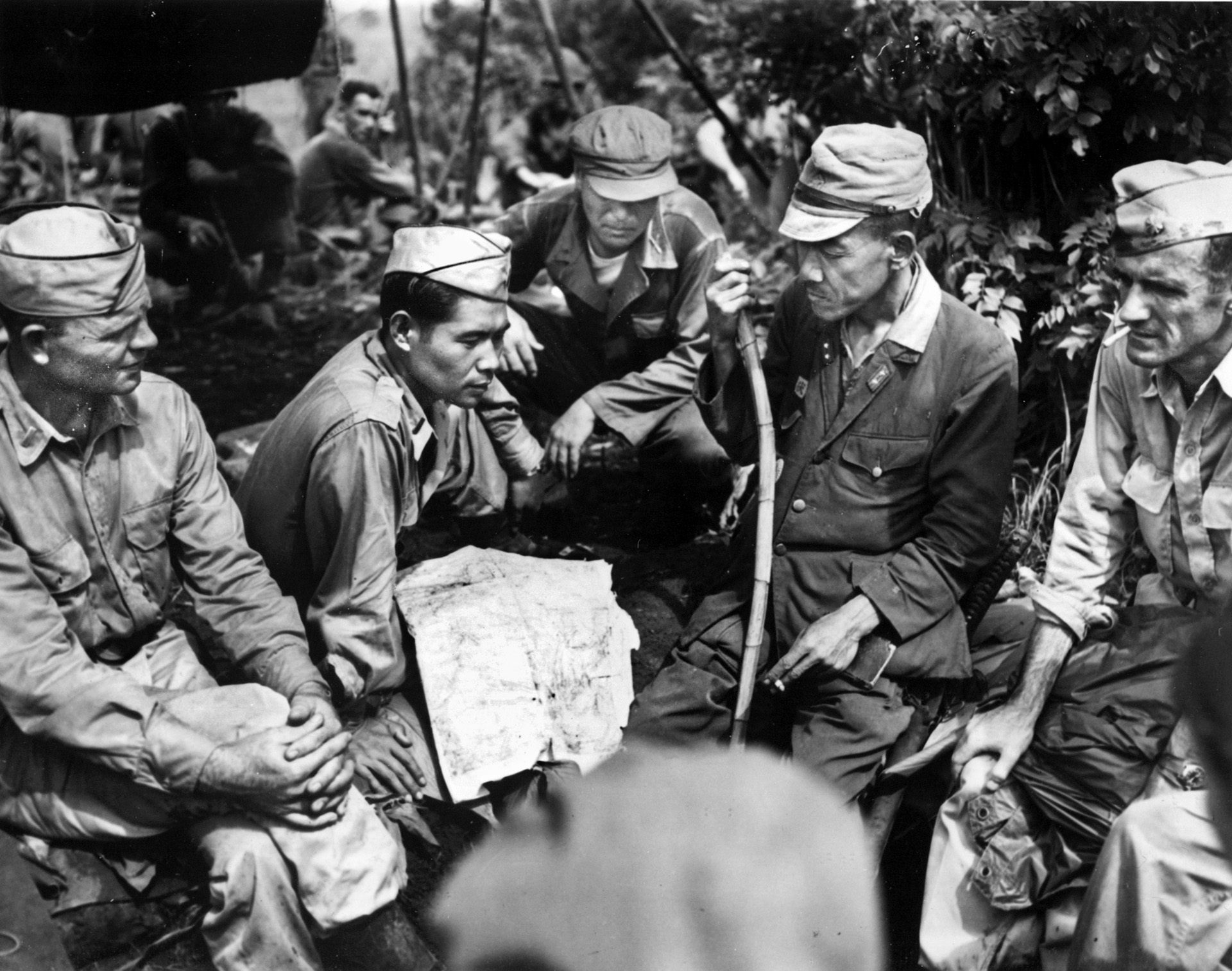 Lieutenant Pat Neishi discusses surrender terms with a Japanese lieutenant general on the outskirts of Manila in 1945. Japanese-American linguists provided outstanding service to U.S. and Allied forces in Asia and the Pacific.