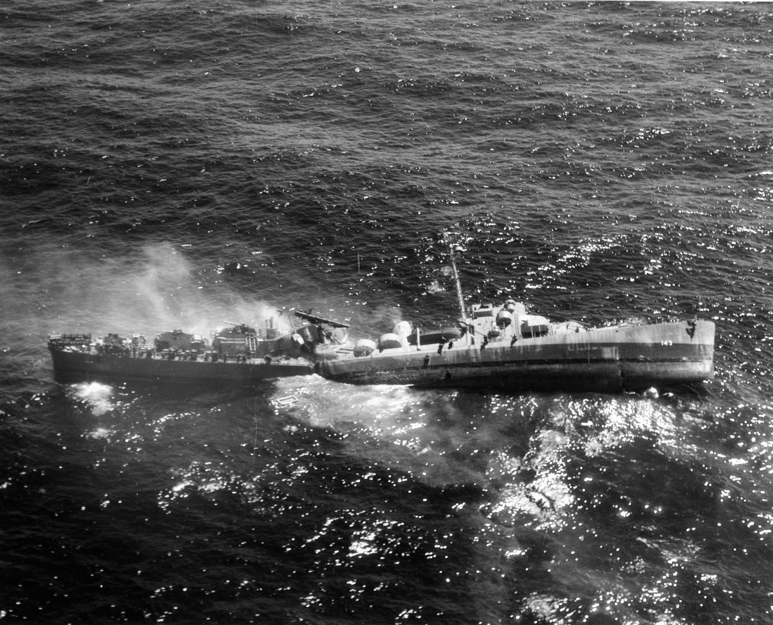 Struck fatally by a German torpedo, a U.S. Navy destroyer escort breaks up and sinks. (United States Navy)