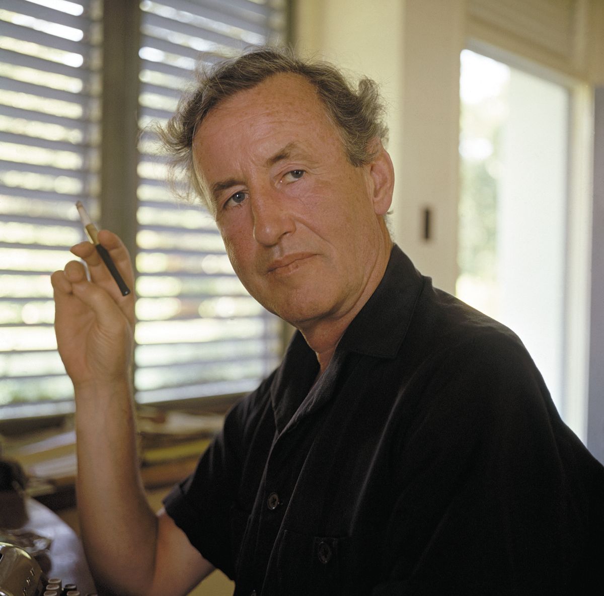 Ian Fleming, the creator of James Bond, works at his typewriter while in Jamaica for the filming of Dr. No., the first of the novels to be translated into film. A very sucessful franchise of Bond films was born 40 years ago. 