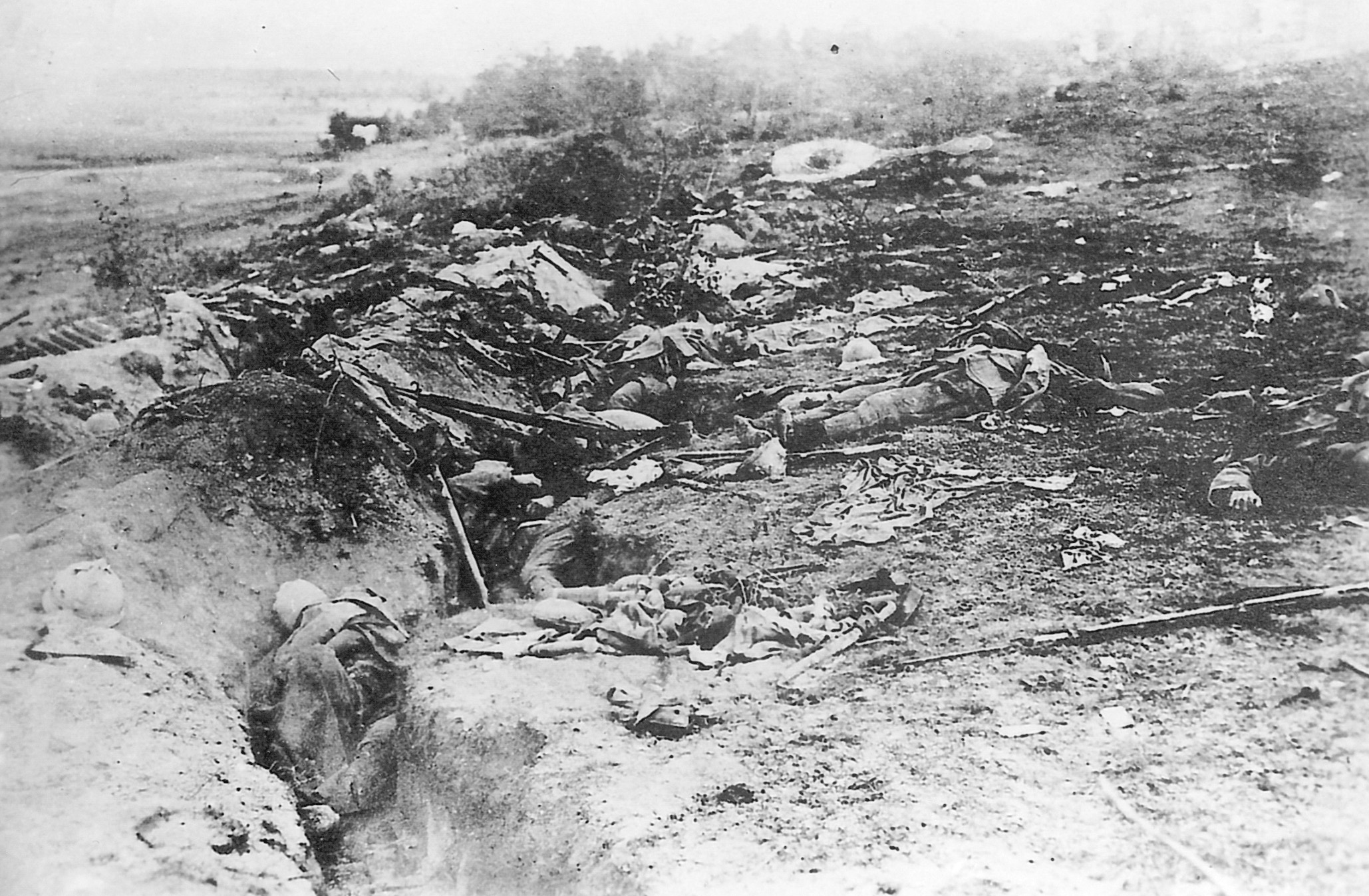 The remains of Frenchmen who died defending their trench line are strewn on the battlefield.