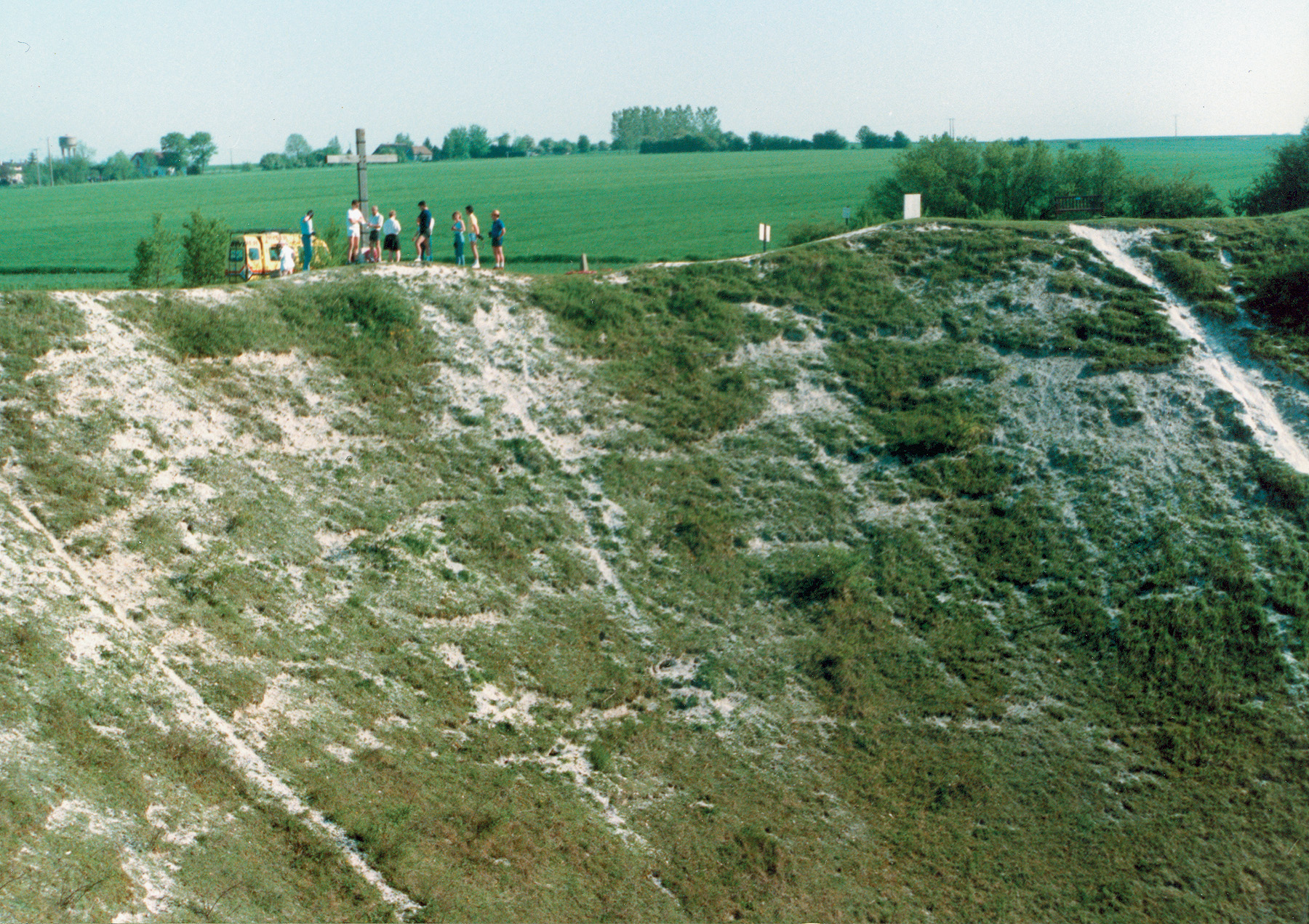 Visitors to the Somme battlefield add scale to the remains of the enormous Lochnager Crater. Explosives set off beneath a portion of the German trenches made the gigantic hole on the first morning of the attack.