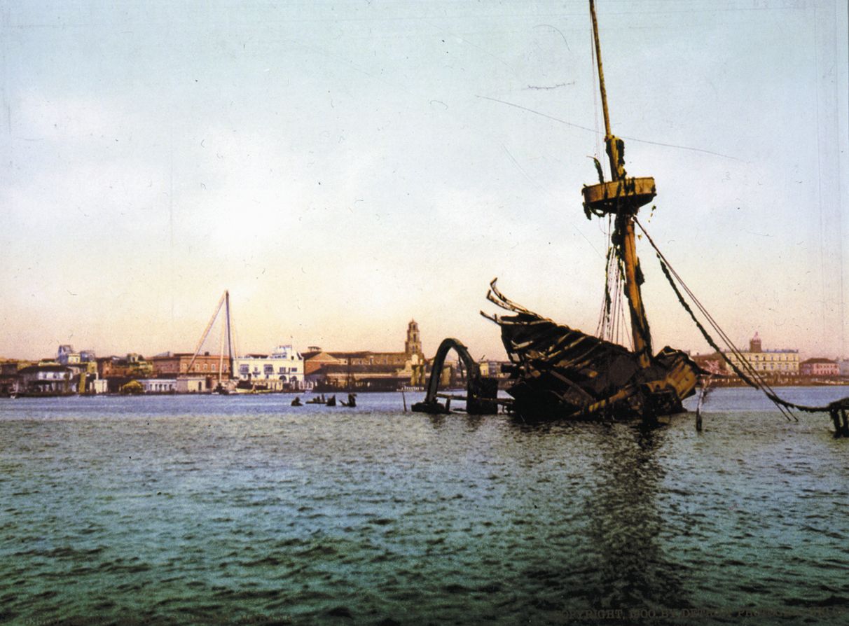 The USS Maine lies scuttled in Havana Harbor in William Henry Jackson’s photograph.