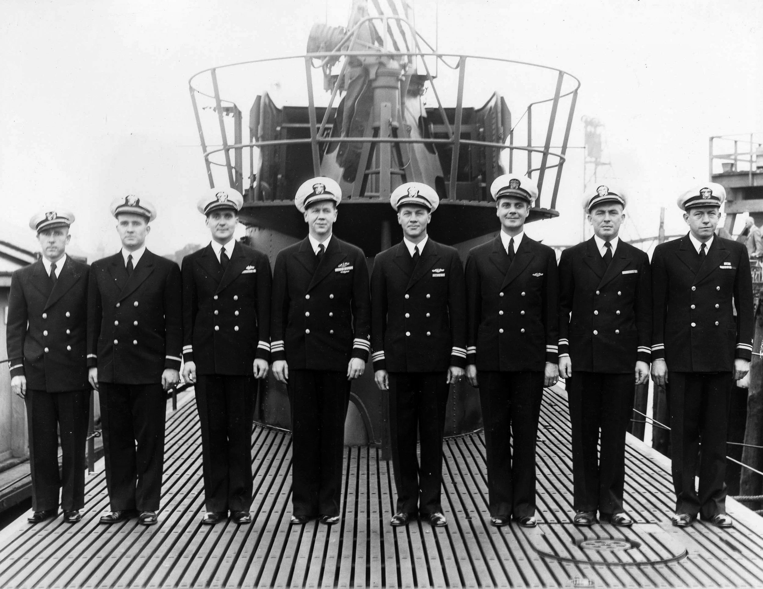 Officers of the submarine USS Archer-Fish pose for a photograph on deck during commissioning ceremonies at New Hampshire’s Portsmouth Navy Yard on September 4, 1943. 