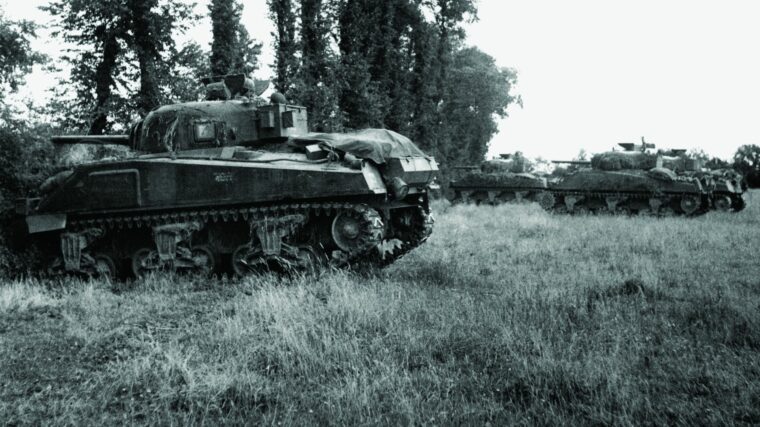 M-4 Sherman tanks of the 11th Armored Division await the call to advance near Eterville on June 30, 1944. Three weeks after Operation Overlord had begun, the fighting near Caen was bitter.