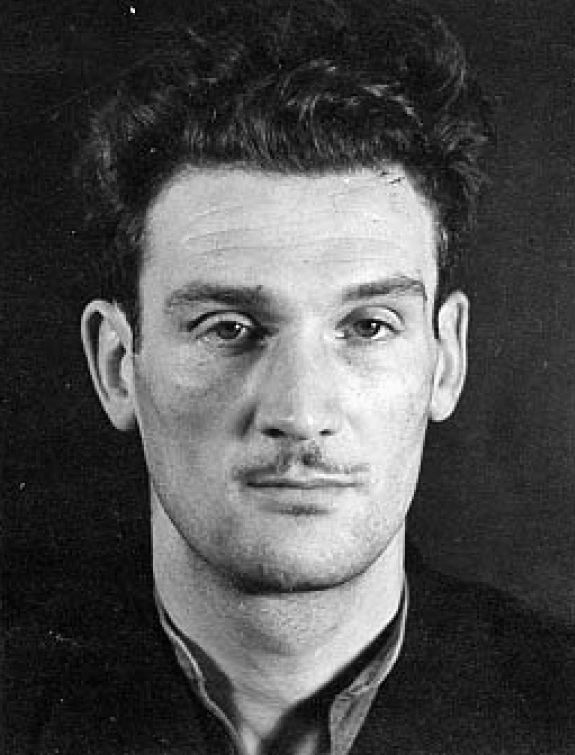 An expressionless Eddie Chapman awaits placement in a jail cell in this unflattering mugshot. (Library of Congress)