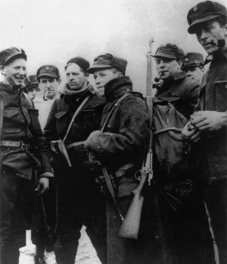 During a lull in the fighting against the Germans at Konigsvinter, northeast of Oslo, Norwegian soldiers enjoy the momentary respite. These troops fought valiantly against a German attack there on April 28.