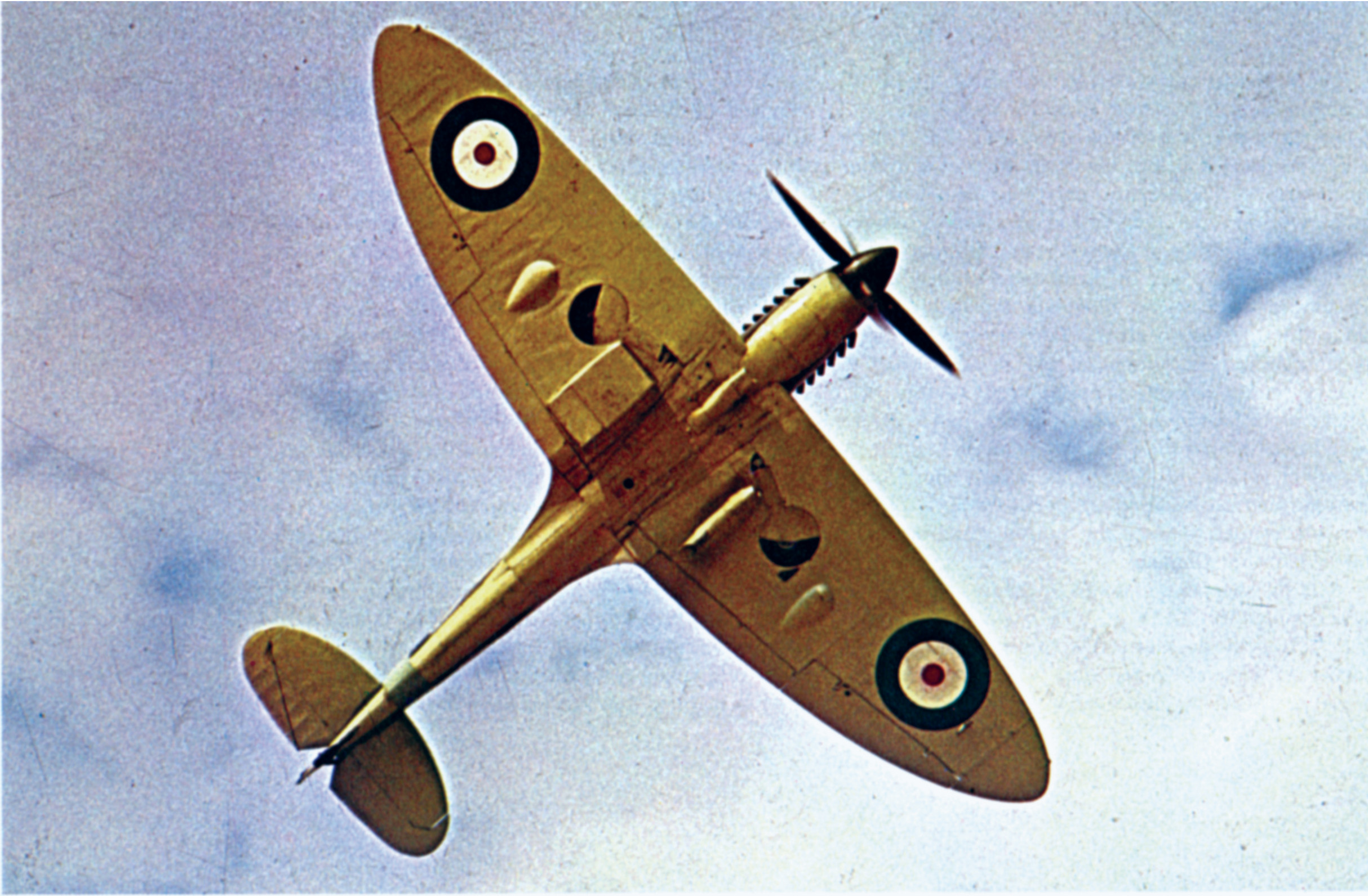 The distinctive elliptical wings of the Supermarine Spitfire are clearly visible in this photograph. The distinctive design made identification of the fighter easy and provided better aerodynamics. (Rue des Archives/The Granger Collection, New York. Below: National Archives)