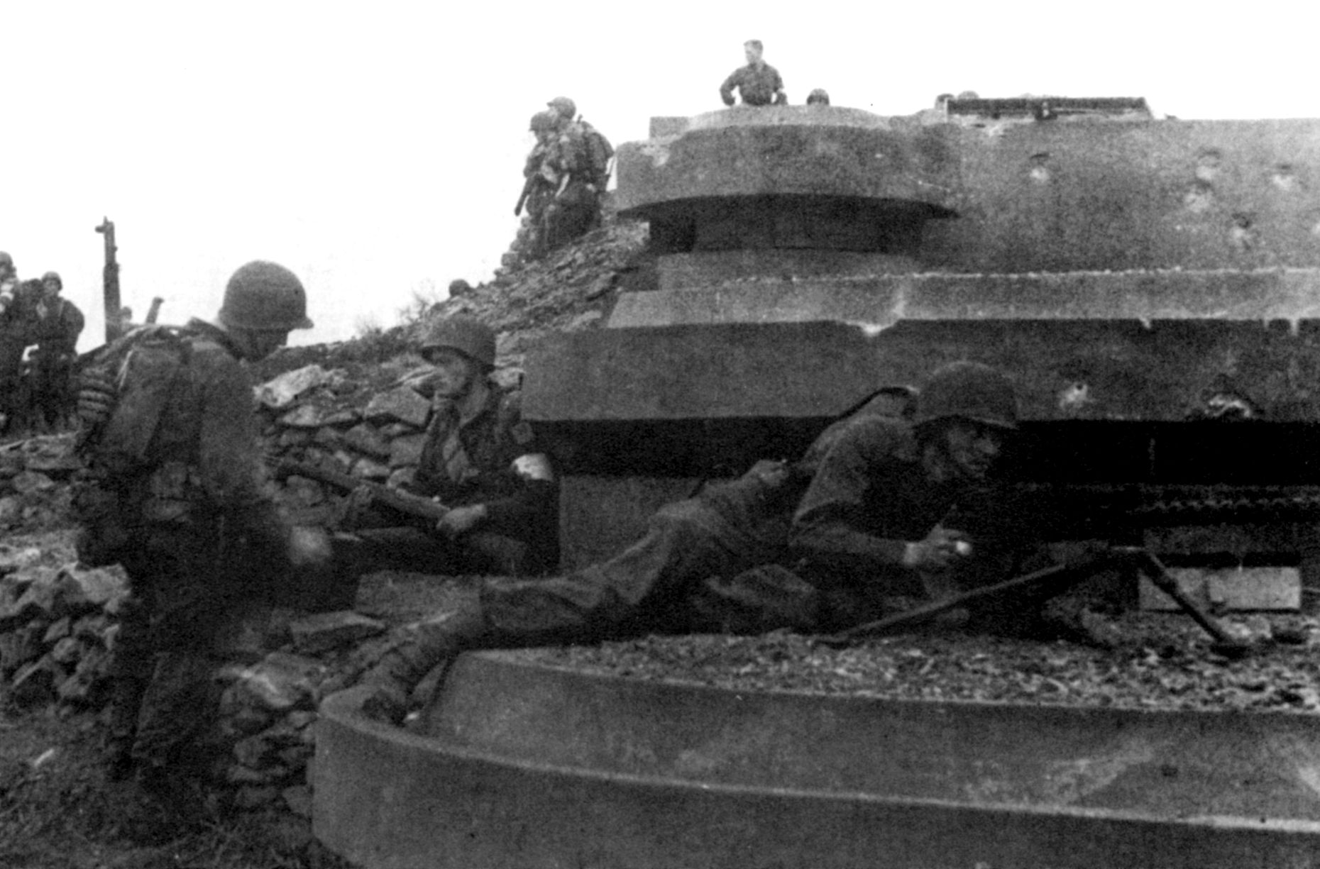 Men of the 1st U.S. Ranger Battalion guard a captured gun position after heavy fighting in Arzew, Algeria. 