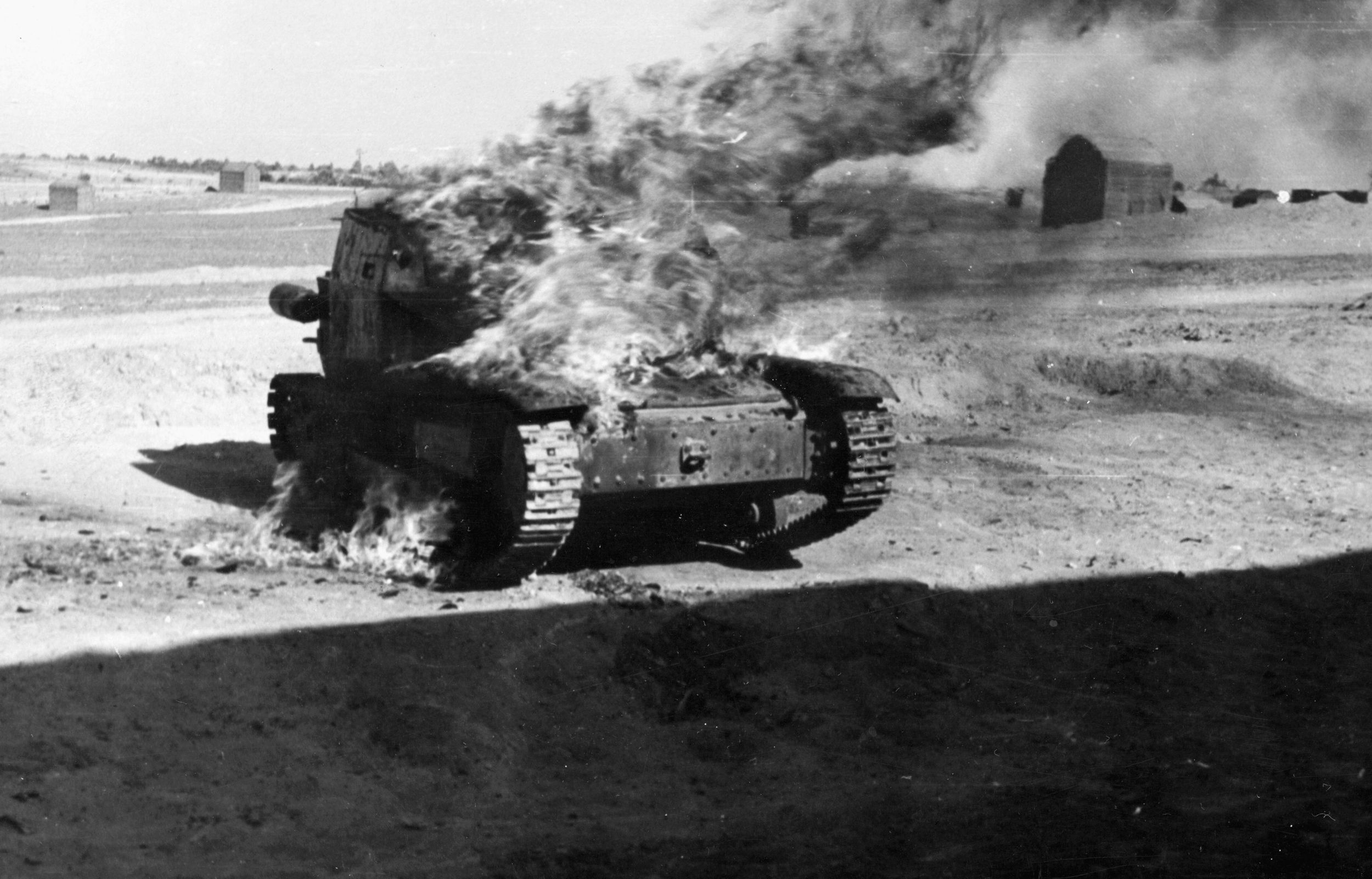 A burning German tank marks the line of retreat from El Alamein. During his preparations for the decisive battle, British Field Marshal Bernard Montgomery made certain that he had numerical superiority.