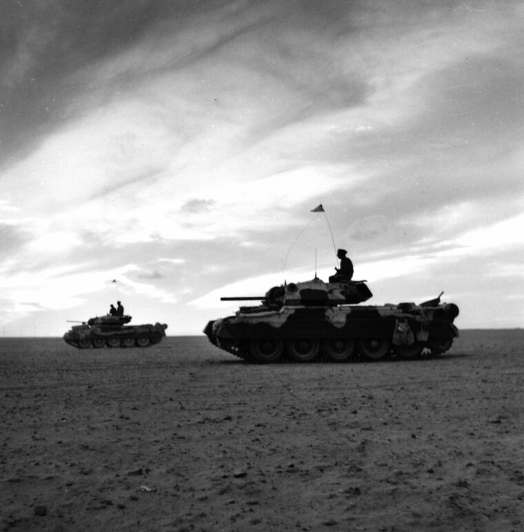 British Crusader tanks, which exploited the breakthrough at El Alamein, take up positions at dusk to defend against a counterattack by the Afrika Korps. Air superiority also took its toll on the retreating Germans