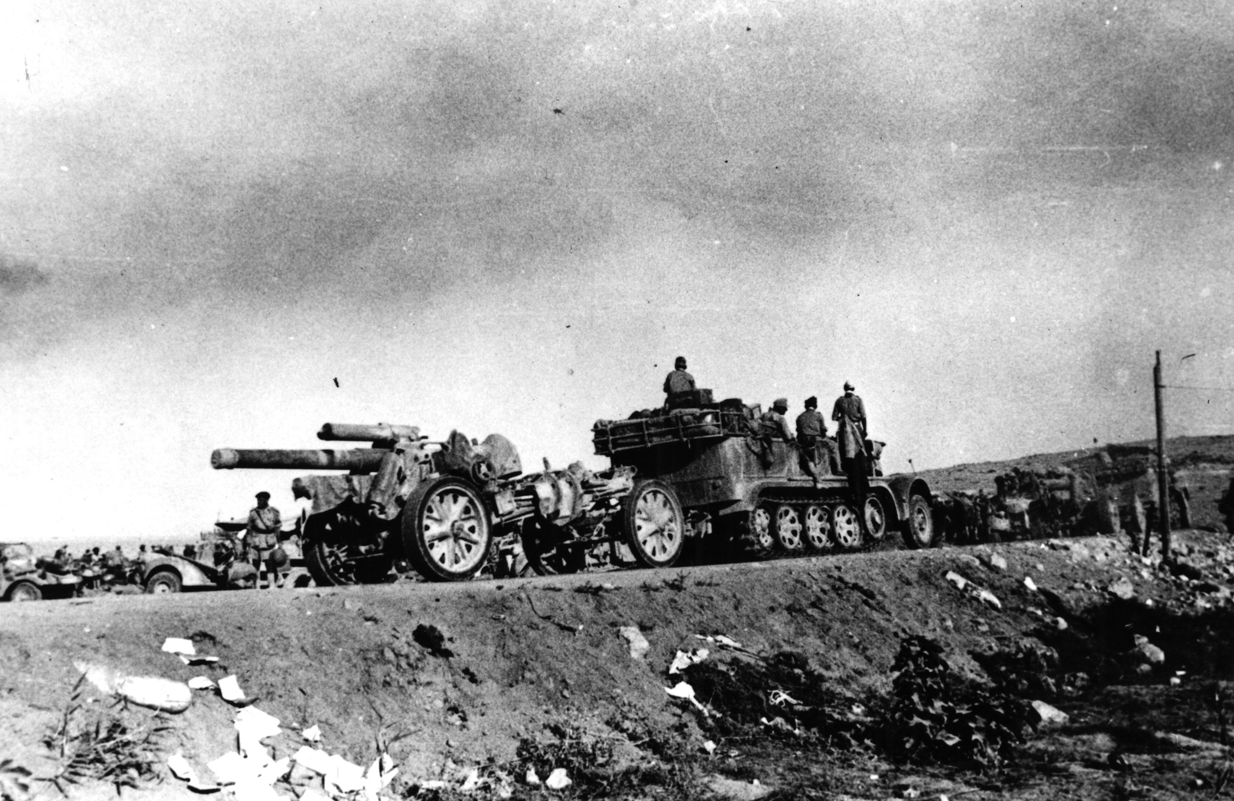 Its carriage towed by a half-track, a heavy German artillery weapon is moved into position during the first phase of the fighting at El Alamein.