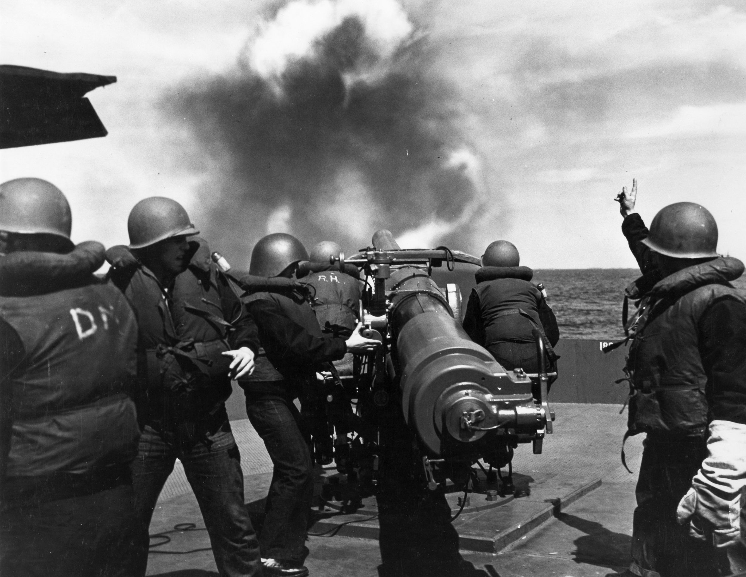 During gunnery practice at sea in September 1943, Naval Armed Guardsmen learn the finer points of operating the 4-inch deck gun aboard a merchant ship. Virtually unknown outside the Navy itself, Armed Guardsmen provided some measure of defense against enemy attack.