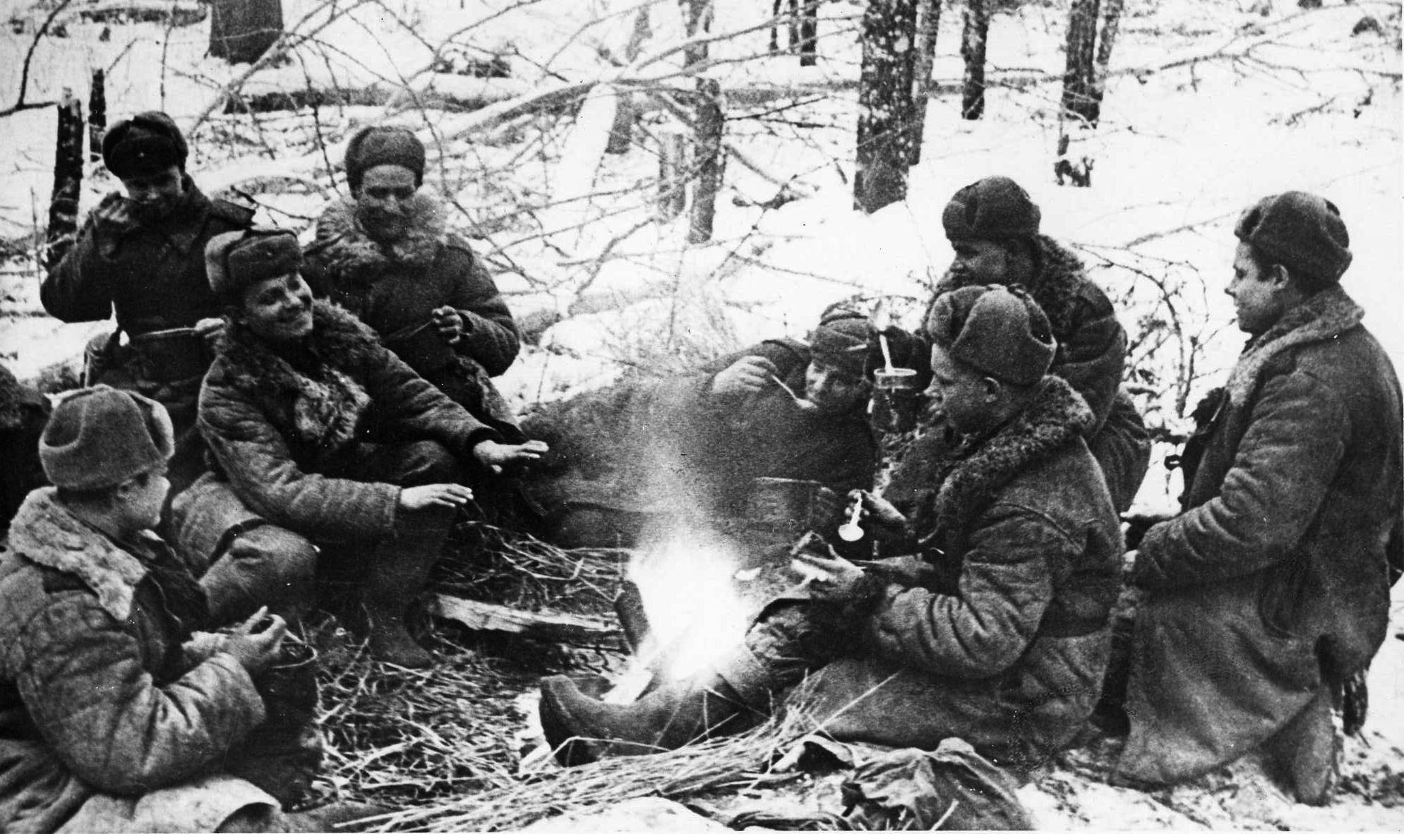  Uniformed against the cold, soldiers of the Red Army gather around a campfire during a lull in fighting on the Eastern Front. The Soviet effort to liberate the Don Basin, Operation Gallop, proved overly ambitious.