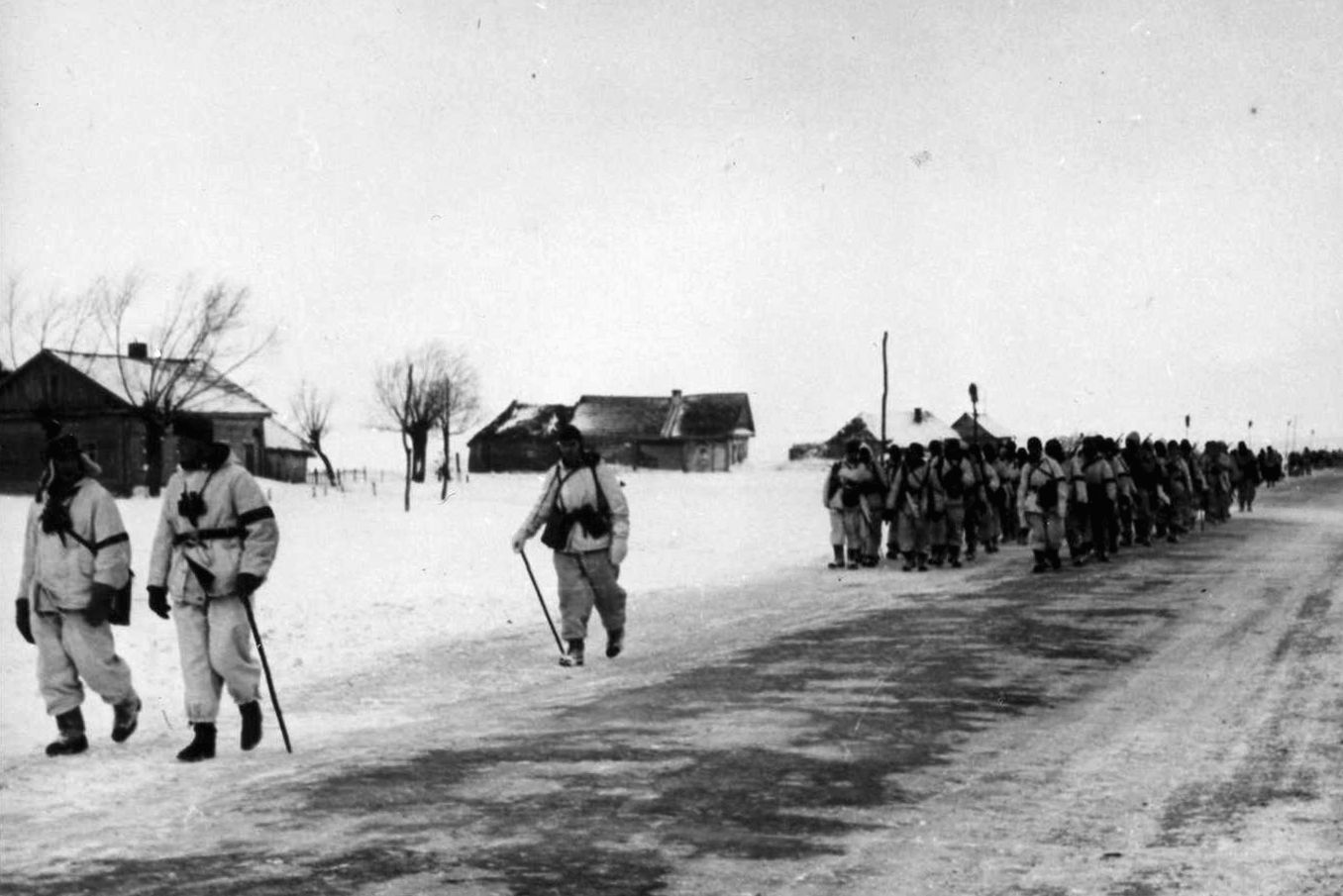 Advancing through a deserted Russian town, German soldiers trek eastward toward the enemy and their crushing defeat at Stalingrad. Although their momentum was halted, the Germans still delivered a bloody repulse to Soviet Operation Gallop. 