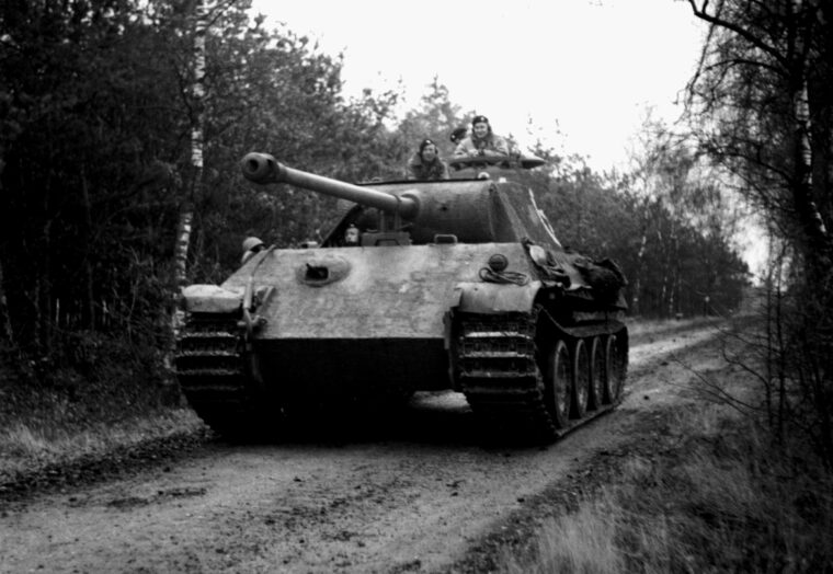 Shown rolling along a dirt road in northwest Europe on November 29, 1944, a captured German Panther tank is in use by the British 4th Coldstream Guards, 6th Guards Tank Brigade. (Imperial War Museum)