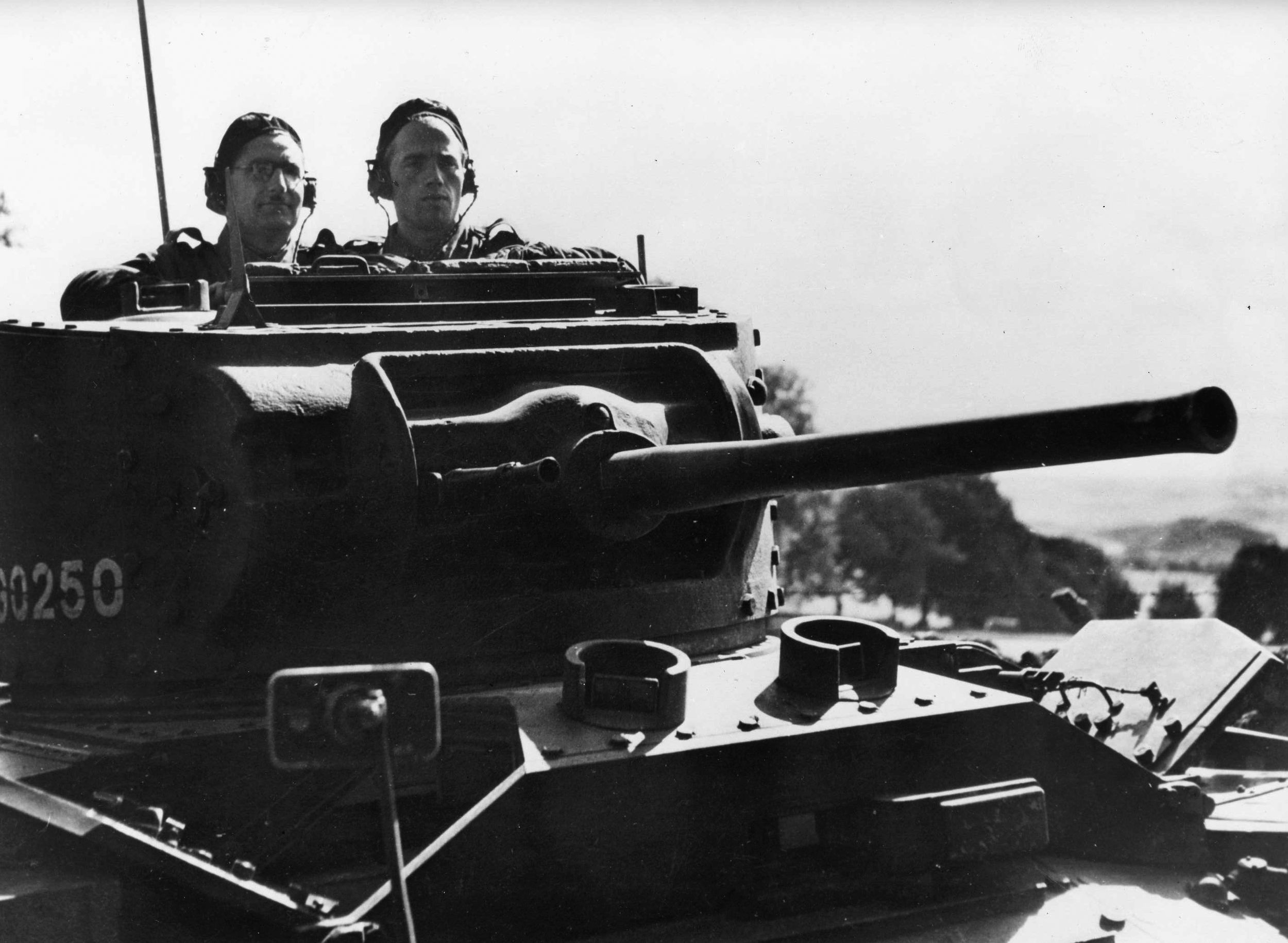 Two Polish tankers peer from the turret of their armored vehicle as they rumble ahead.  This image was taken somewhere in the Near East. Polish troops served in numerous locales during the war. (Both: National Archives)