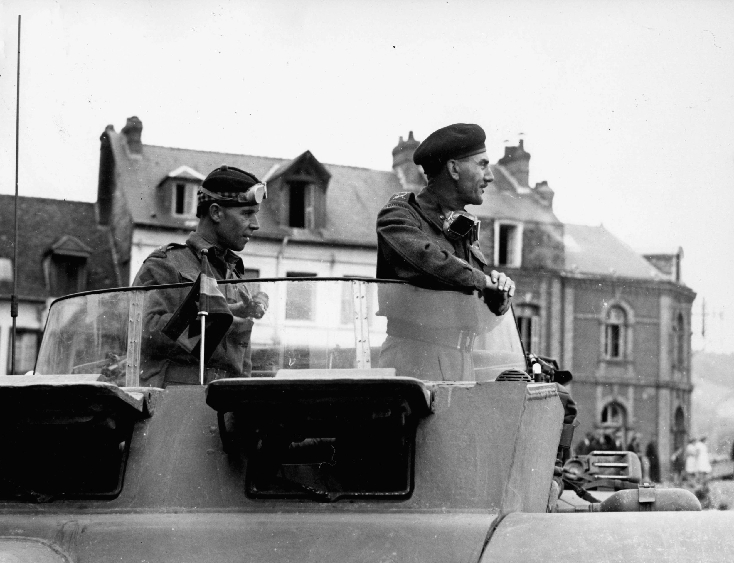 Lieutenant General Guy Simonds watches closely as the first tank of his Canadian II Corps crosses the River Seine in France. The II Corps also included the Polish 1st Armored Division.