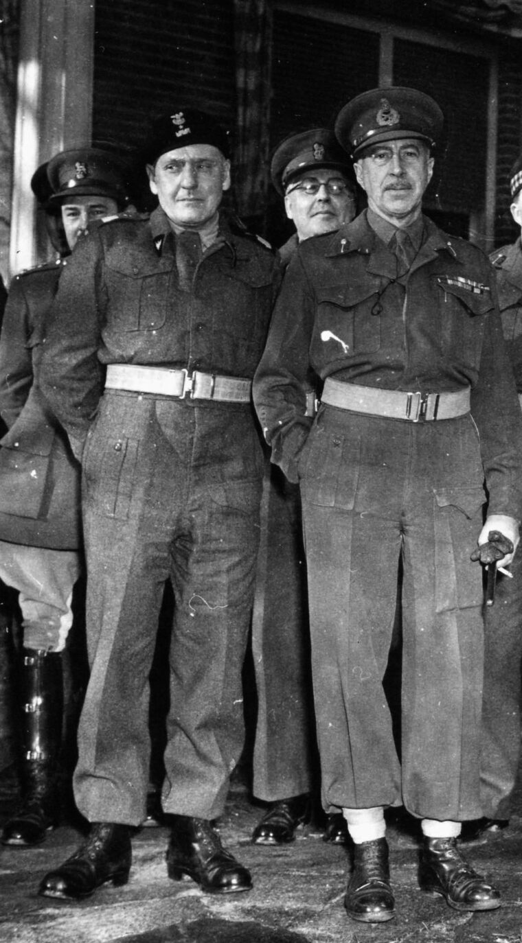 Polish Major General Stanislaw Maczek (left) and British General H.D.G. Crerar pose for photographers during a visit to the headquarters of the First Canadian Army by General Dwight D. Eisenhower on November 29, 1944. 
