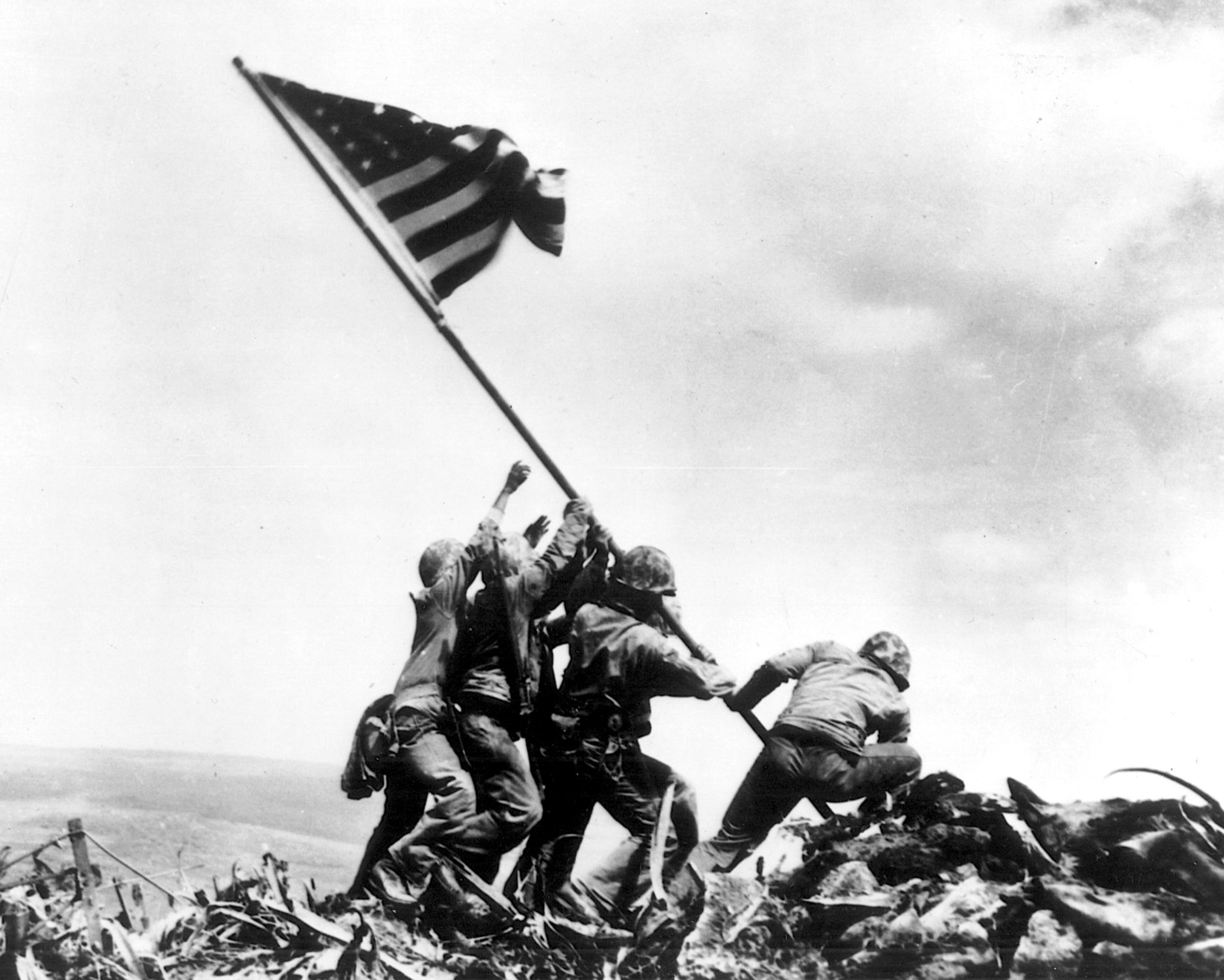 The famous photo of the flag raising atop Mount Suribachi on Iwo Jima was captured almost by chance when the shutter of AP photographer Joe Rosenthal clicked. The image remains an enduring legacy of World War II. 