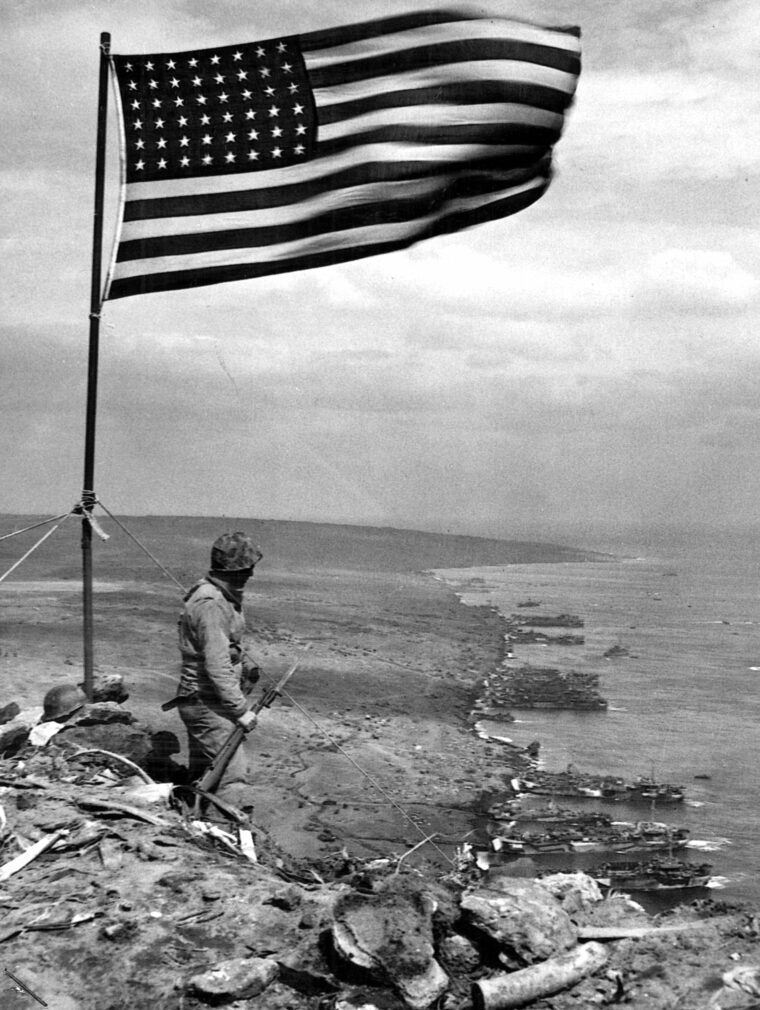 The Stars and Stripes waves atop Mount Suribachi.