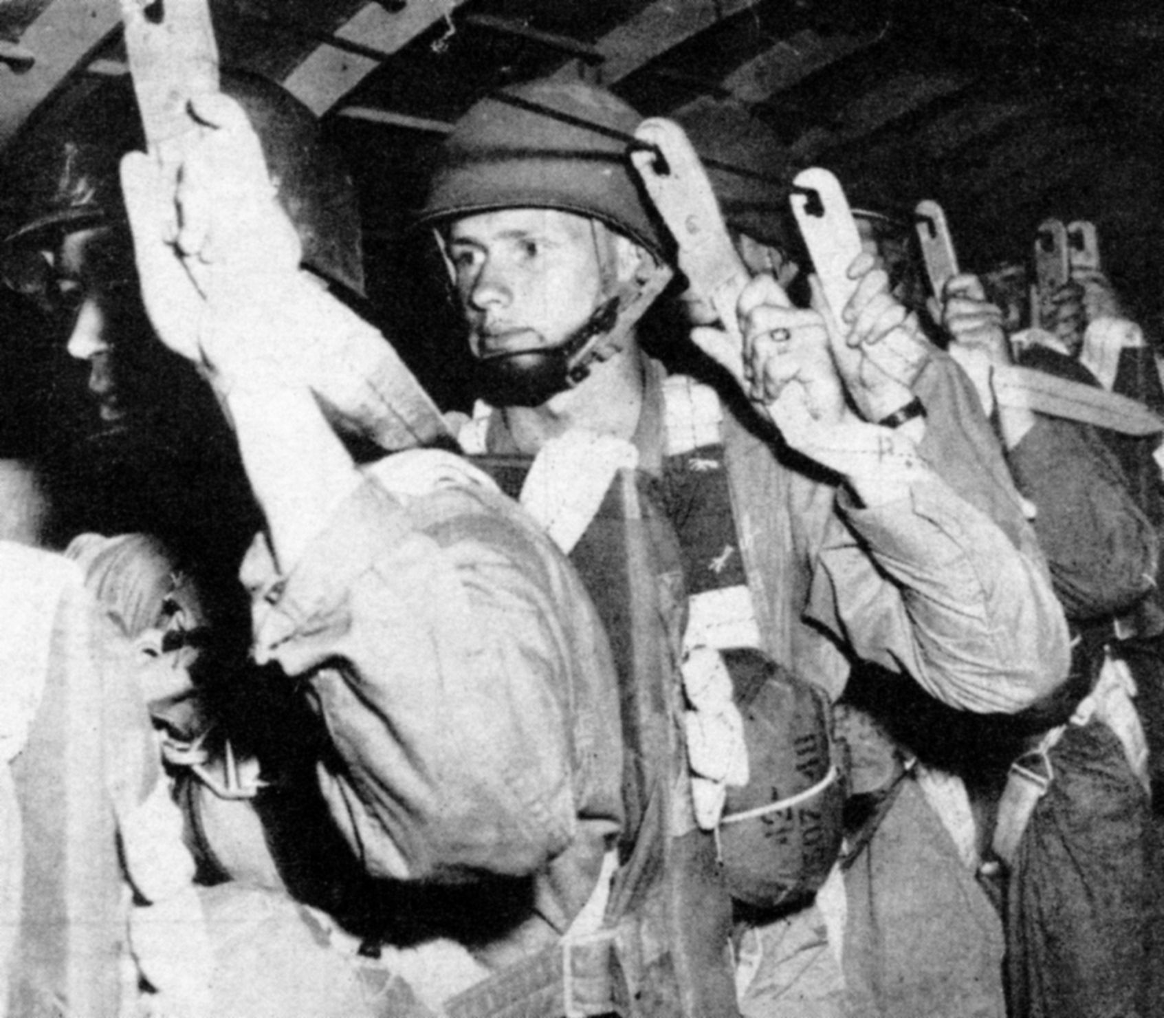 With his static line hooked up, Lieutenant John Singlaub is shown moments before exiting his transport aircraft during a training jump. The exercise was held at Fort Benning, Georgia.