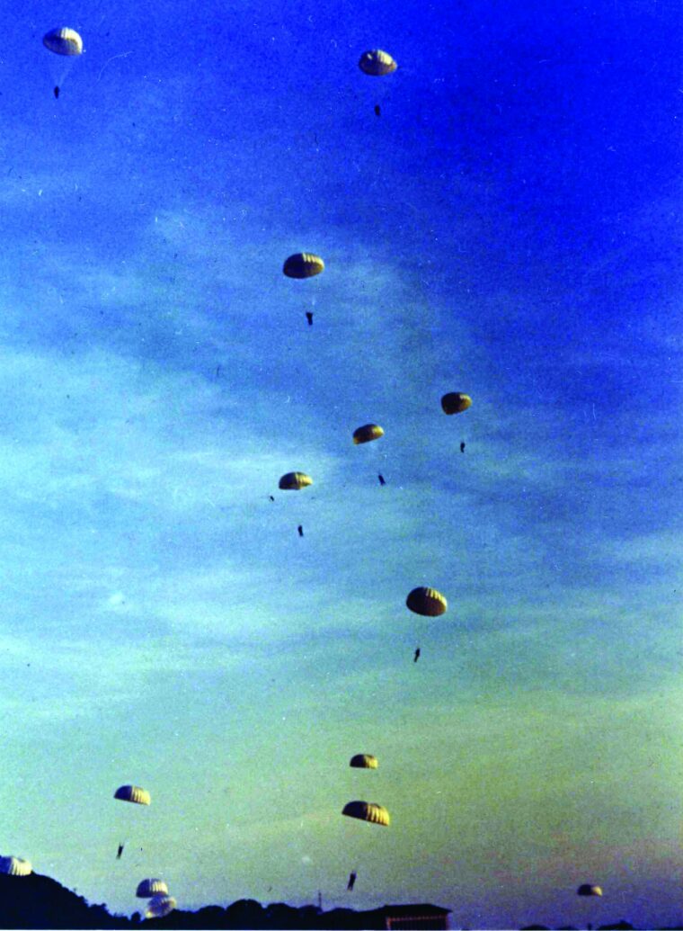 At Albrook Field in the Panama Canal Zone, the 551st Parachute Infantry Battalion performs a demonstration jump before a large crowd during a war bond drive in February 1943. (National Archives)