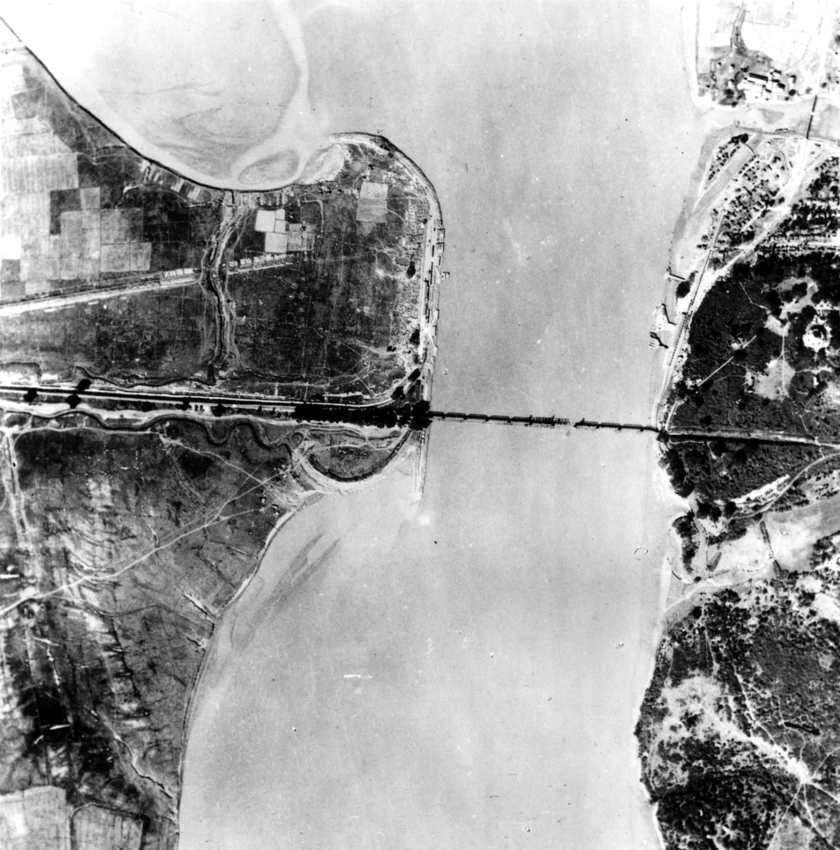 An aerial view of the railroad bridge across the Sittang River conveys a sense of the stream’s breadth, which challenged the Commonwealth forces during their withdrawal.
