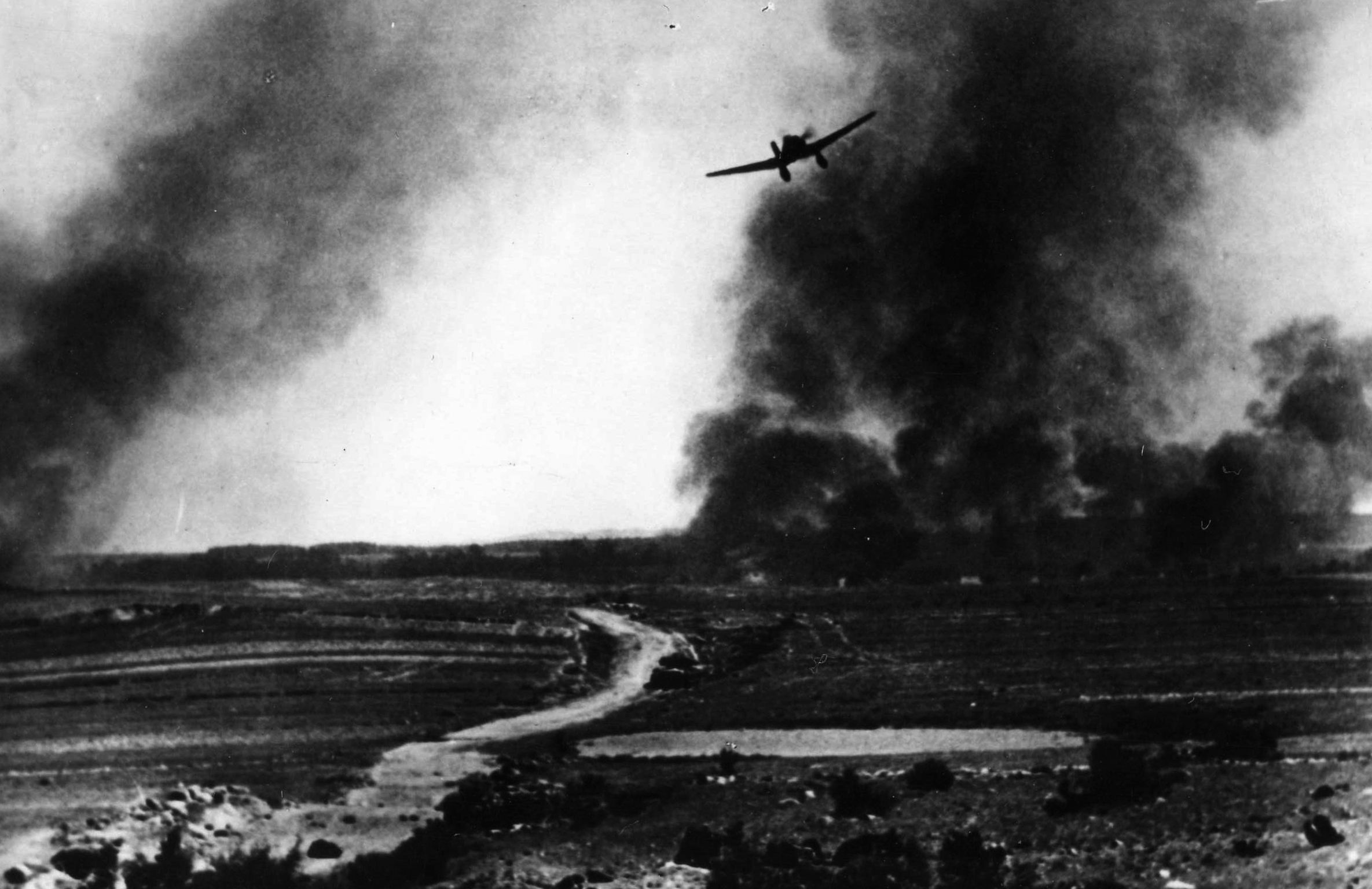 Photographed from the ground, a German Ju-87 Stuka dive-bomber pulls out of its dive against a Red Army tank on the Eastern Front. A number of Stukas were later armed with tank-busting 37mm cannon under the wings. 