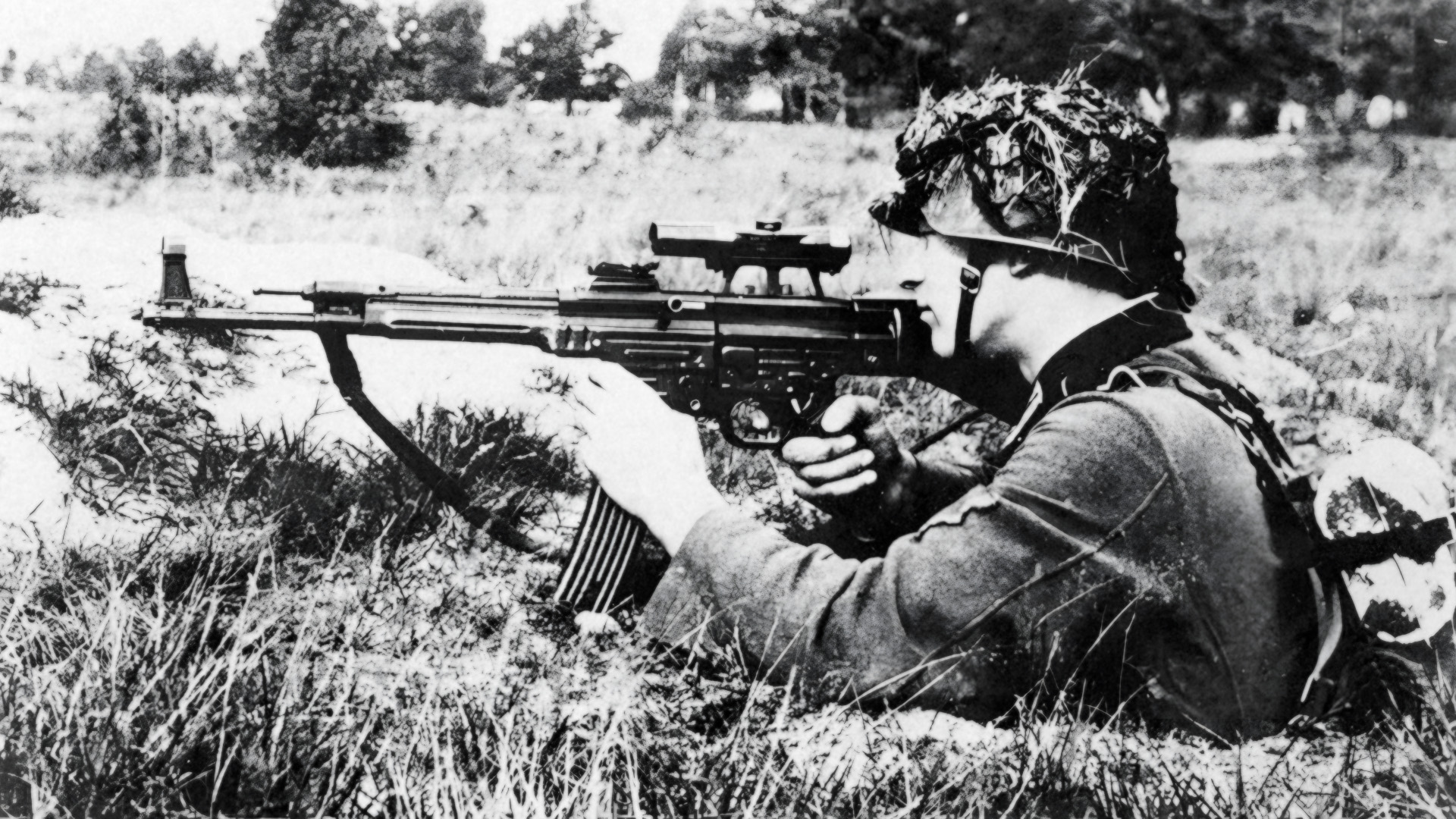A German soldier tests an MP 43/1 for suitability as a sniper weapon in October 1943.