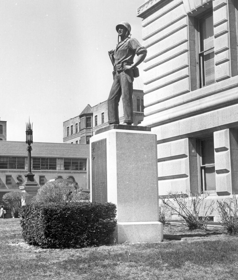The statue of Marine Lieutenant John V. Power stands larger than life on the lawn in front of City Hall in Worcester, Massachusetts.