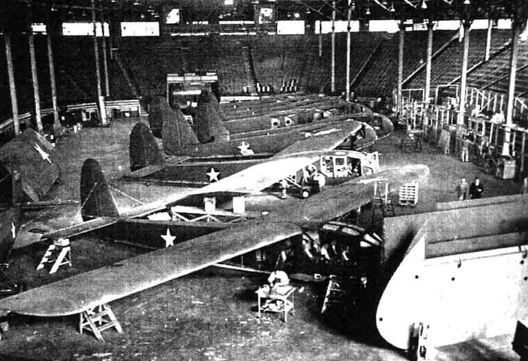 Waco CG-4A and CG-3A (pictured) glidersare assembled by Rearwin/Commonwealth workers in the arena at the American Royal complex in Kansas City, Missouri.