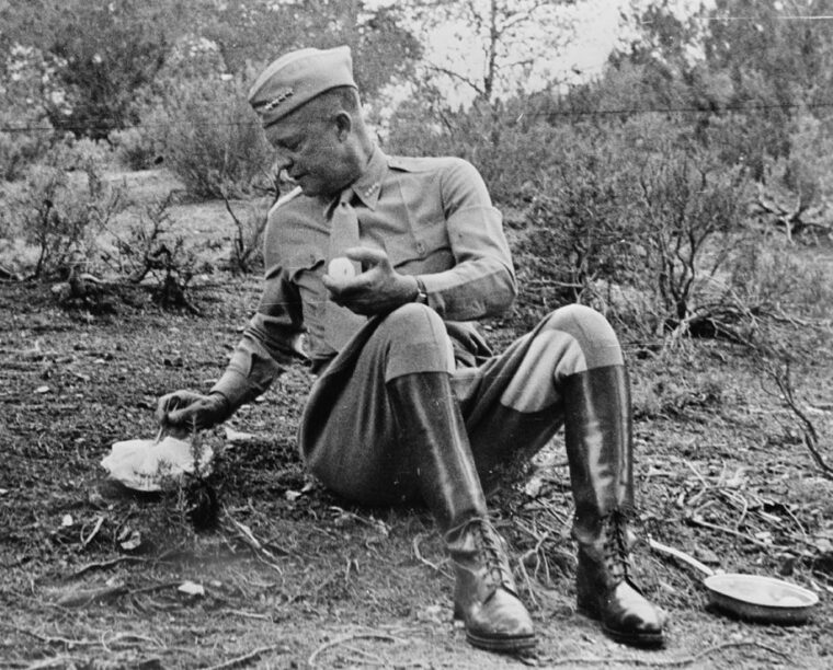 Supreme Commander of Allied Forces in the Mediterranean, General Dwight D. Eisenhower sits on the ground to eat a C Ration during an inspection of Allied troops in Tunisia in 1943. The C Ration fed hungry American soldiers into the 1980s.
