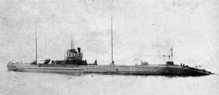 The Japanese submarine I-21, which torpedoed the SS Cape San Juan, is shown before the war. Note the deck gun forward of the conning tower and the crew of the submarine, turned out on the deck for review.