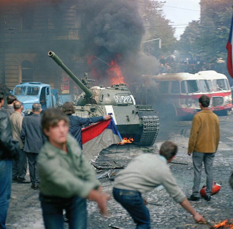 People throw Molotov cocktails and stones at Soviet Army tanks in front of the Czechoslovak Radio station building in central Prague during the first day of Soviet-led invasion to then Czechoslovakia on August 21, 1968.