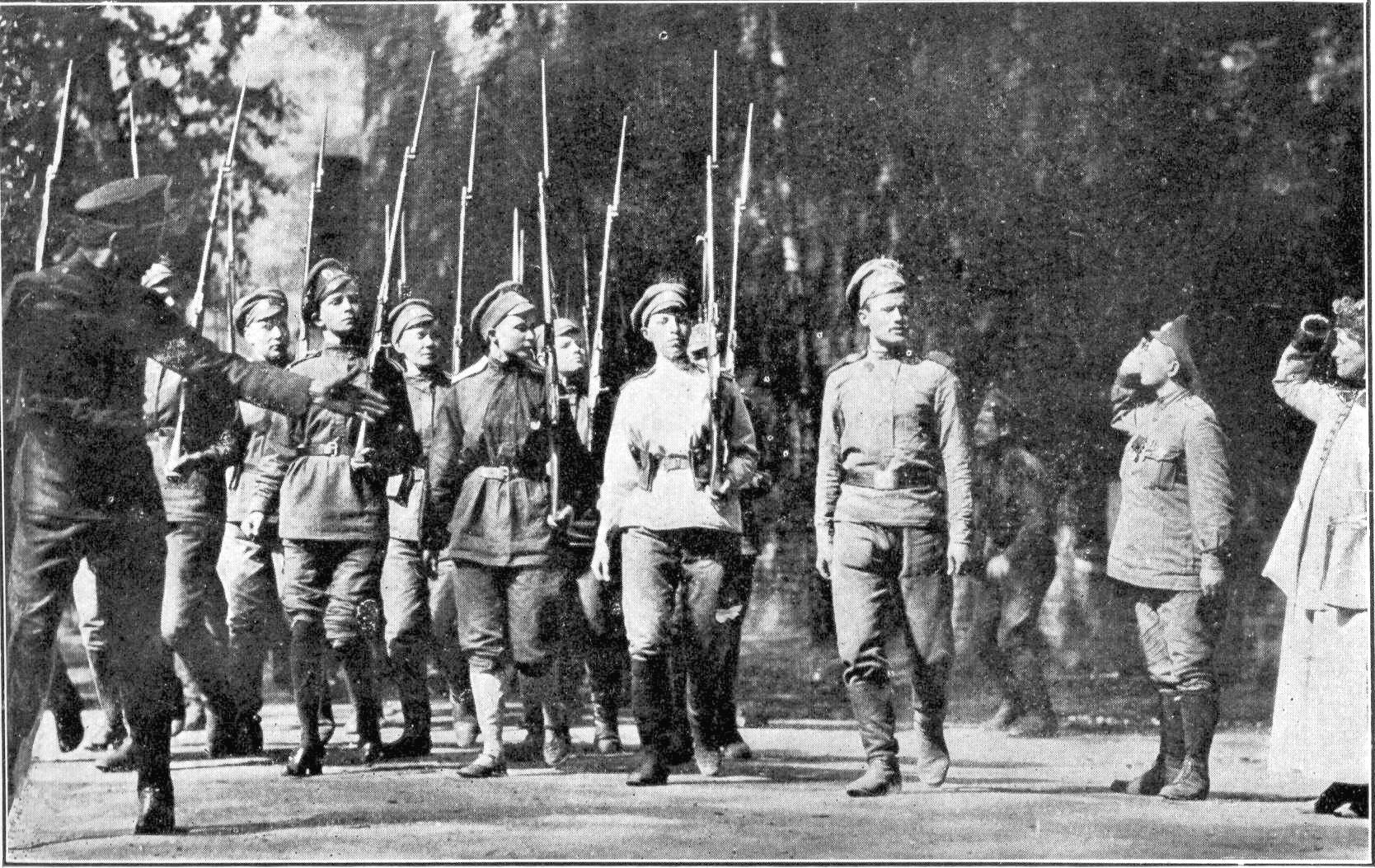 British suffragette Emmaline Pankhurst (far right) salutes the women of the Battalion of Death as they parade before going off to the front. They led the charge that broke the German lines.