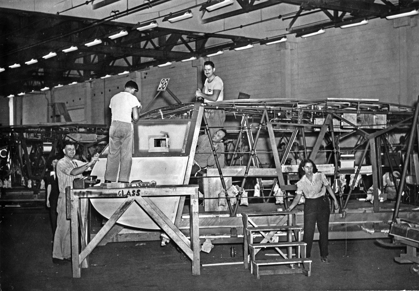 Pratt, Read employees perform primary assembly work on a Waco CG-4A glider. With over 70,000 parts, the CG-4A proved almost impossible for manufacturers with little or no aircraft-making experience to build.